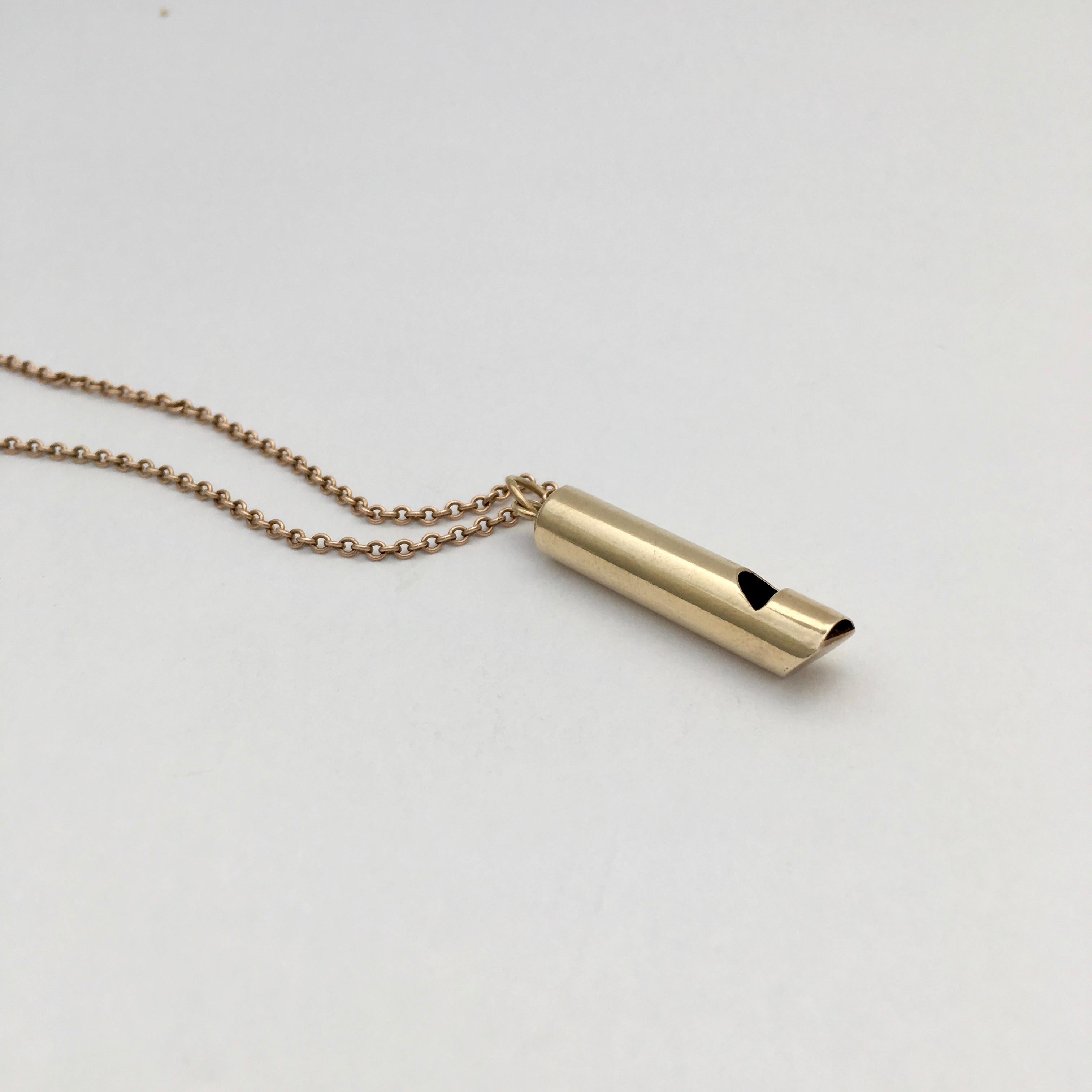 This vintage 9ct gold whistle charm was made in London in 1976. It is in full working order and produces a good sharp whistle. The whistle is 3.6cm long (not including bale and link) and perfectly proportioned to make a stylishly quirky pendant.