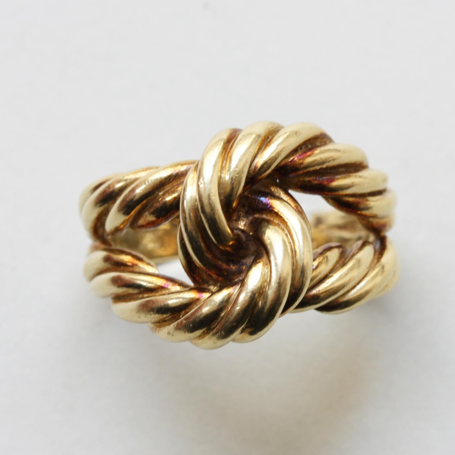 A vintage 14 carat gold knot rope ring.

weight: 10.7 grams
size: 19 mm. / 9 US.