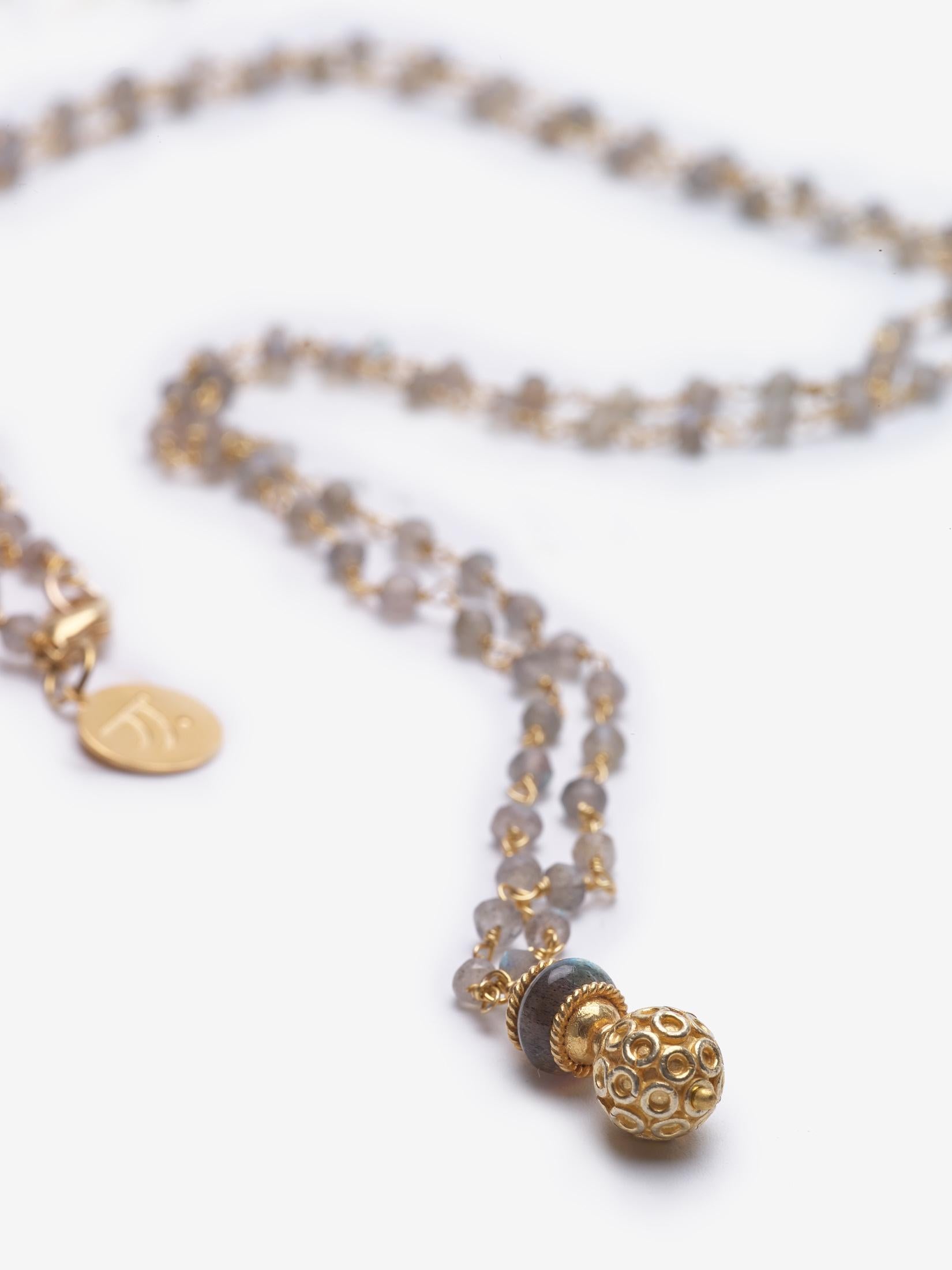 Story Behind the Jewelry
The necklace is symbolic of the pagodas which pepper the landscapes of South East Asia.  The necklace is comprised of a beautiful labradorite 14K gold filled gemstone chain.

Properties
Labradorite is a transformational