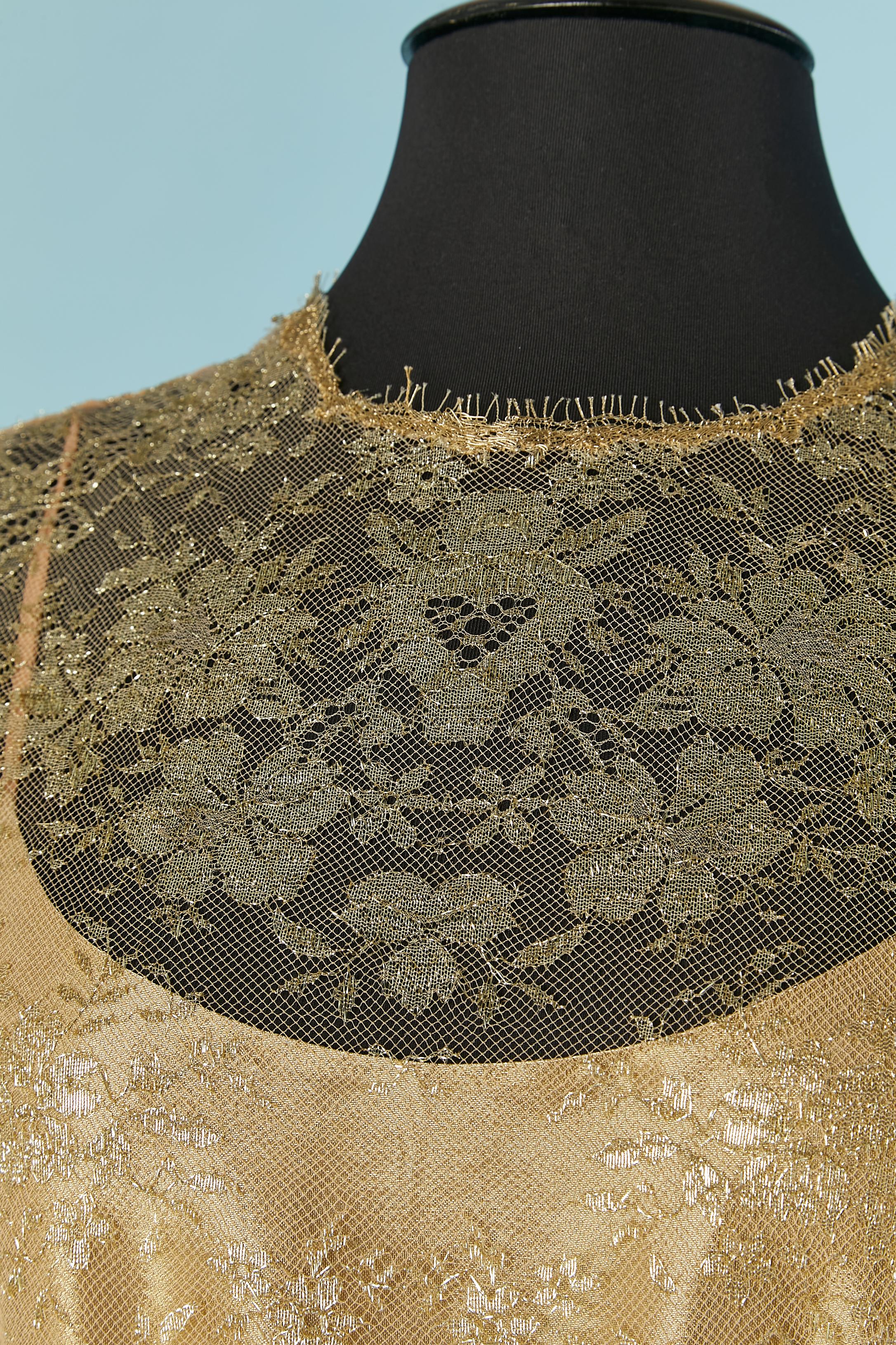 Gold lace evening dress with ruffles on the bottom. No fabric tag composition but the metallic lace is on the top of a gold taffetas slip dress with silk lining. The ruffles are made of a lay of gold lace on the top of a gold taffetas lay with stiff