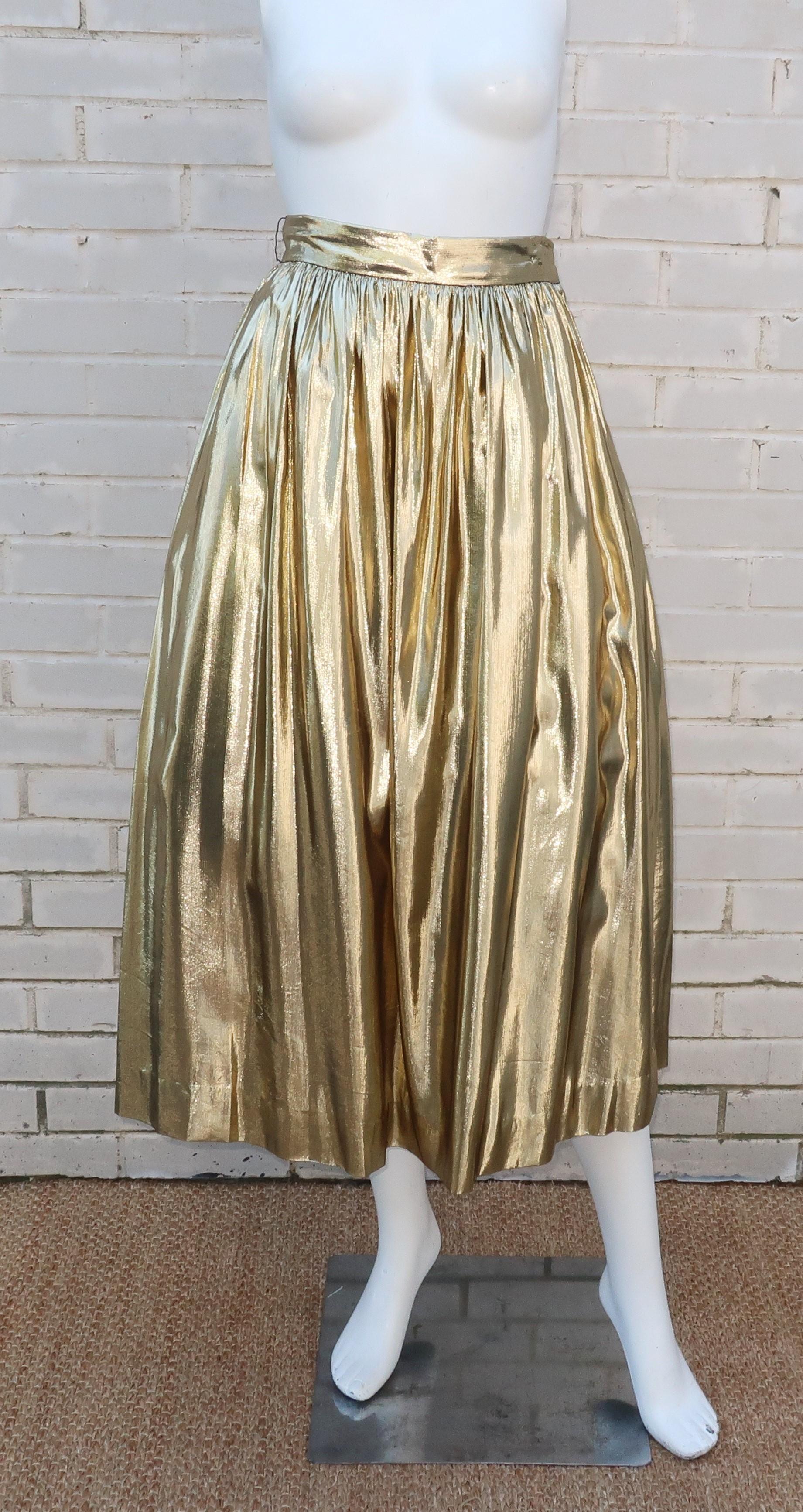 Get a disco diva look with a 1970’s pleated gold lamé skirt by Partique New York with a built in black net crinoline.  The drape of the fabric is reminiscent of a glamorous theater curtain with a great combination of weight and sheen.  The contents