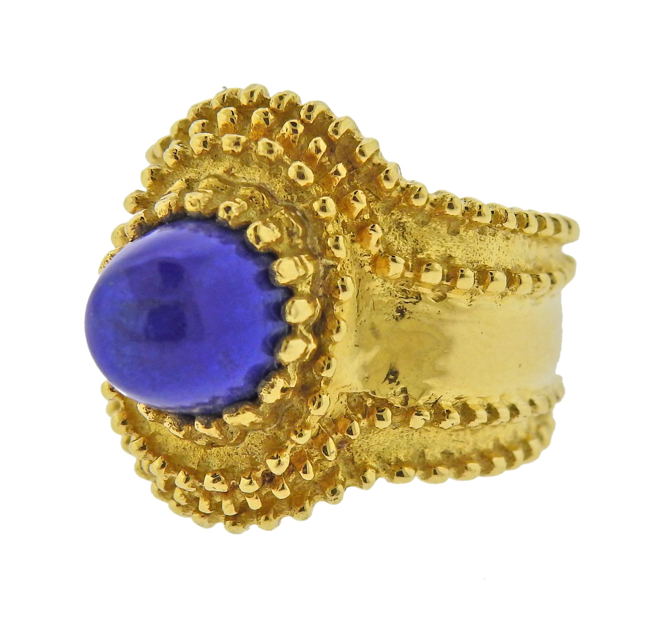 18k gold ring with lapis lazuli in the center. Ring size - 6, ring top - 20mm wide. Marked: 750 and Italian mark on the outside of the shank. Weight - 9.7 grams.