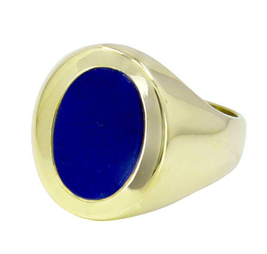 Outstanding signet ring.  Made and signed by TIFFANY & CO.  Bezel-set oval lapis, in a heavy gauge 18K yellow gold mounting that hugs the finger. Size 8 and can be custom-sized.  Exceptional -- clean and classic.

Alice Kwartler has sold the finest