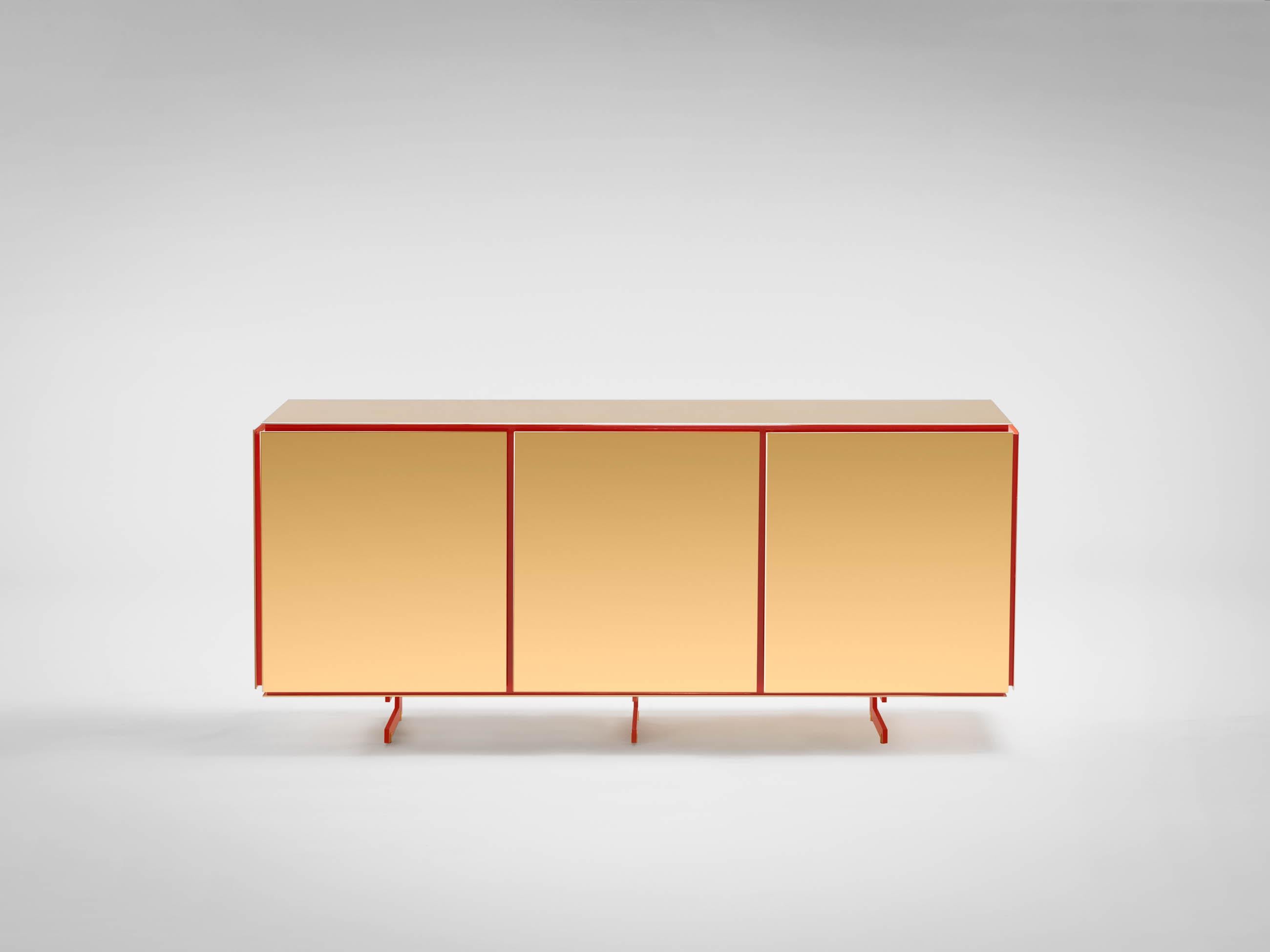 Gold large sideboard by SEM.
Dimensions: W 160 x D 42 x H 70 cm.
Materials: Polished or fine brushed 24kt yellow gold plated, Inlays in lacquered wood.

SEM is a new brand of home furnishings, designed and produced in Italy. The preview show at
