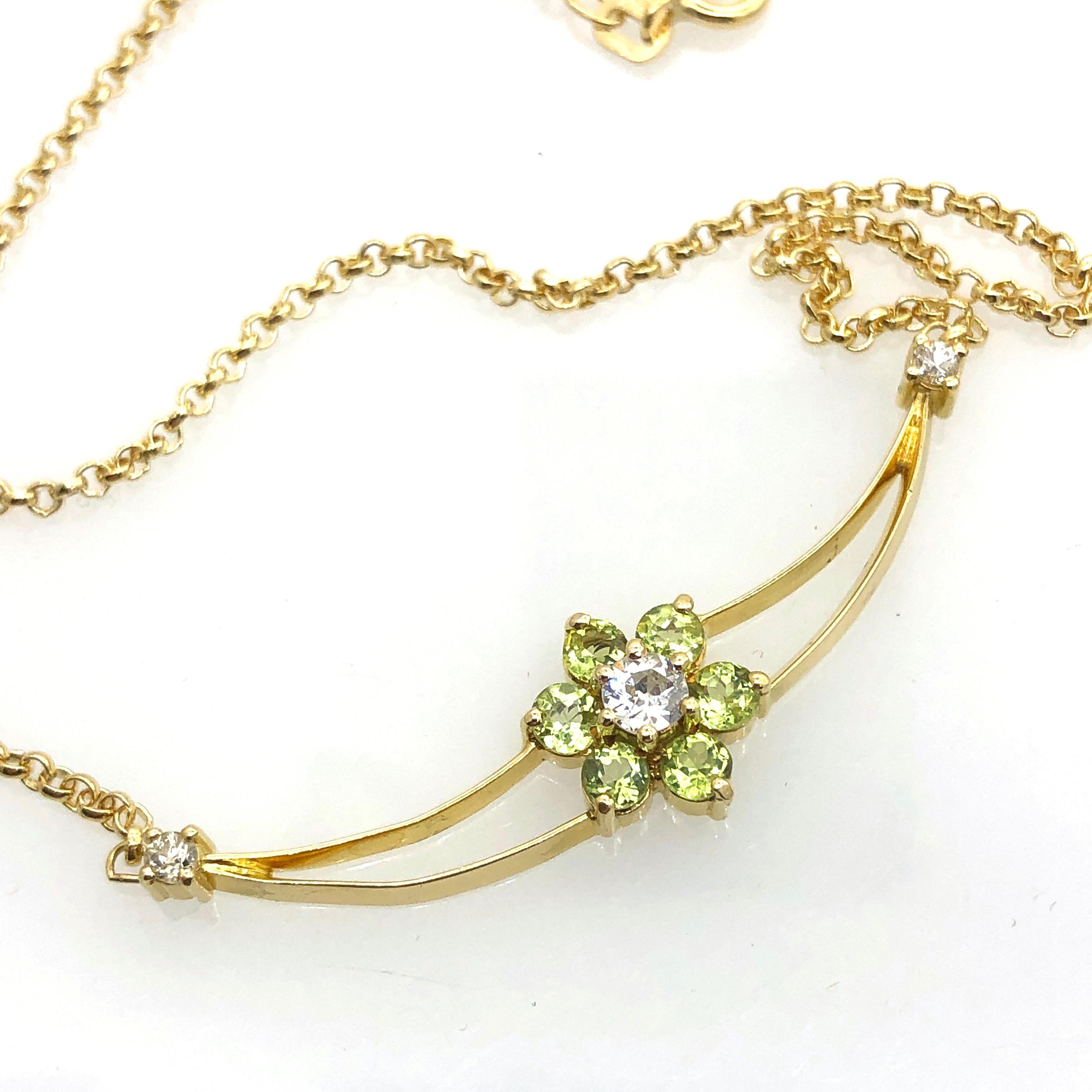 gold necklace with three diamonds