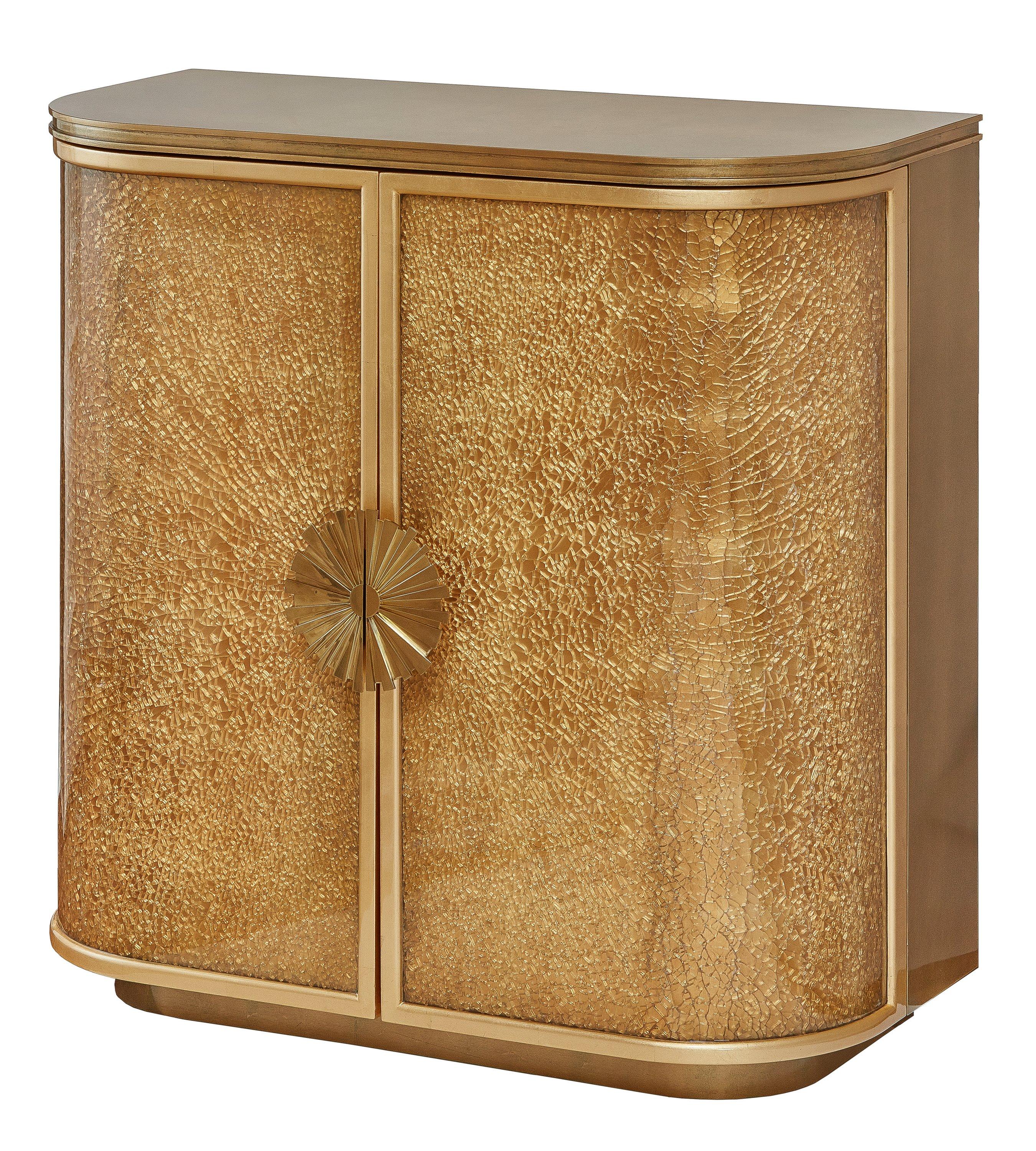 The exceptional cabinet with doors made of cracked or shattered glass texture curved panels. This difficult and unique technology gives crystalline spider web of cracks, which marvelously change light reflected from the gold leaf surface beneath the