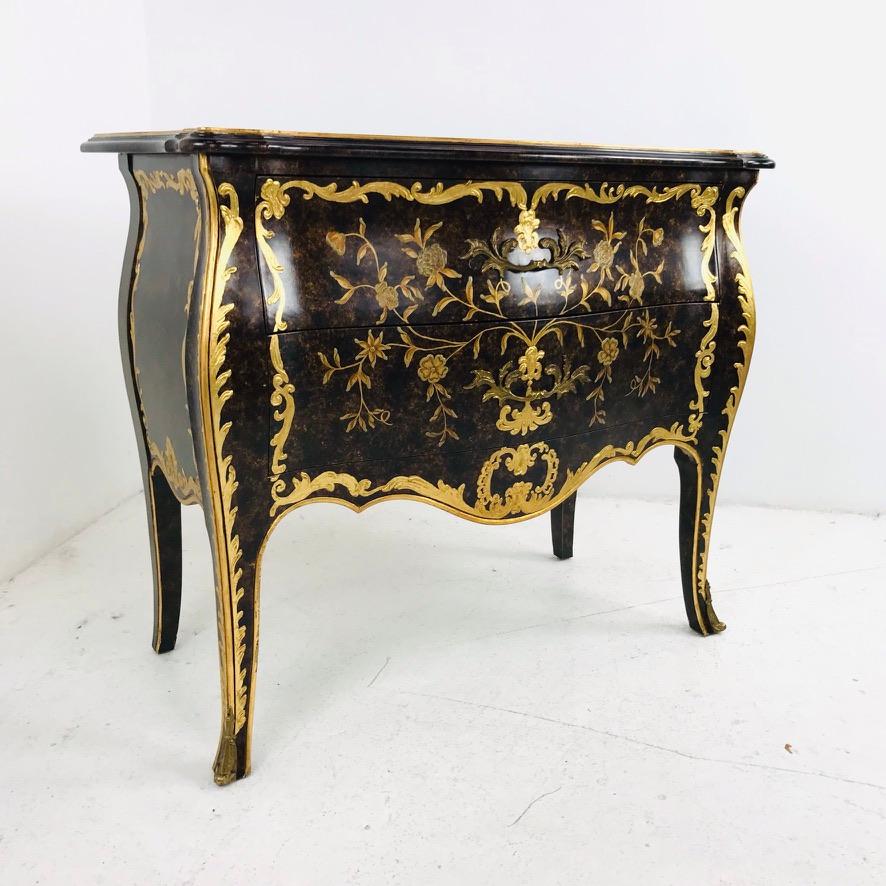 This gorgeous Louis XV chest by John Widdicomb has incredible French style with a classic serpentine Bombay silhouette, elegant French styled details, and raised design with gold leaf finish. The condition of this commode is secure and sturdy. There