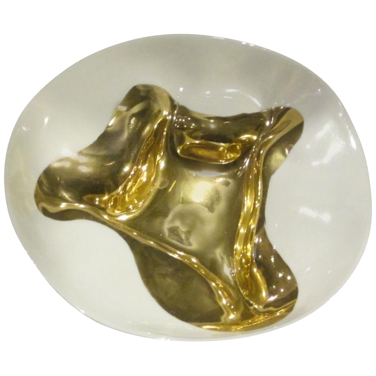 Contemporary Italian handmade gold leaf accented bowl.
freeform organic shape.
Fine ceramic base.
Similar bowls are available in 7