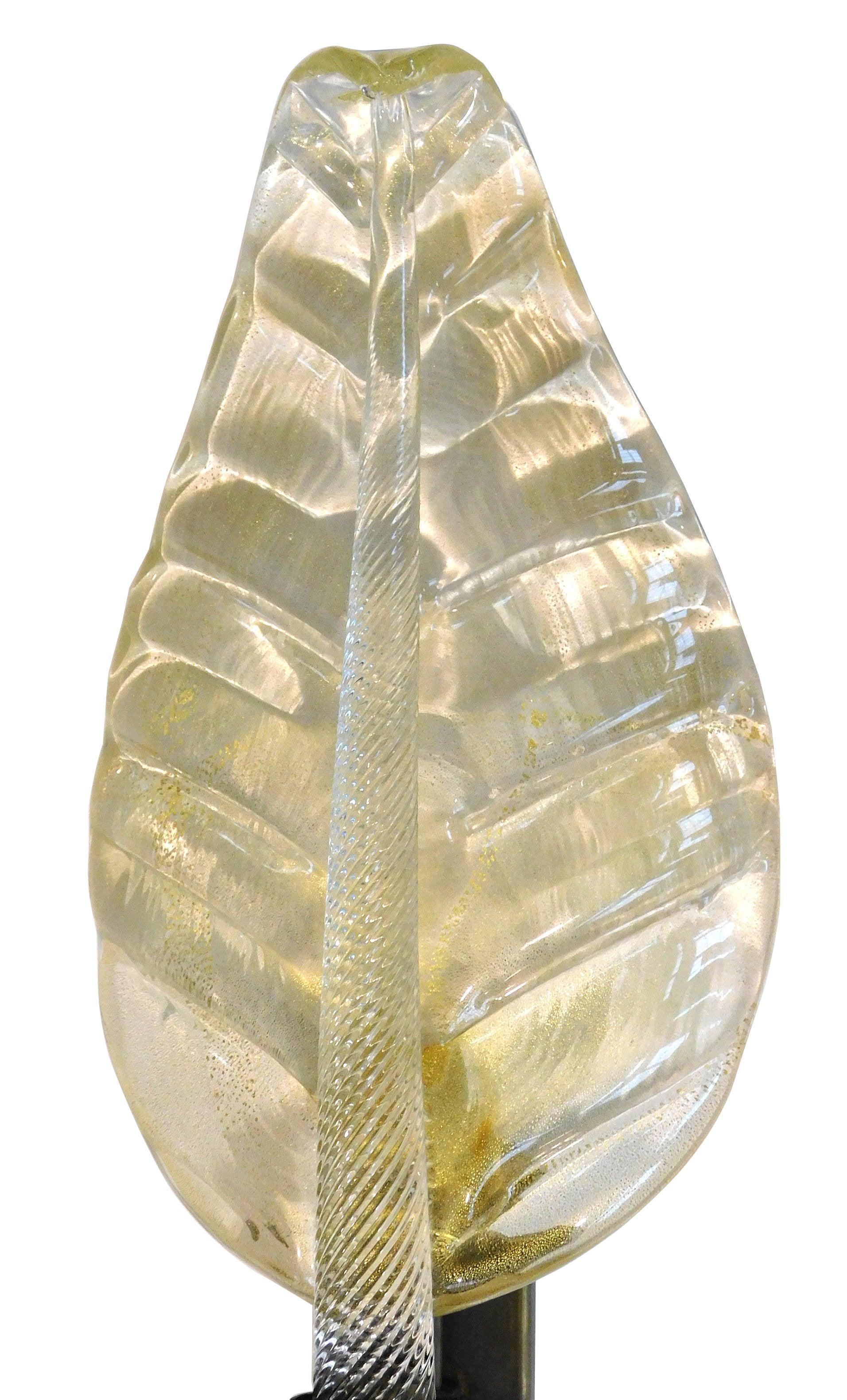Italian leaf shaped wall light shown in hand blown Murano glass infused with 24-karat gold flecks mounted on bronze frame designed by Fabio Bergomi for Fabio Ltd / Made in Italy
1 light / E14 or E12 type / max 40W each
Measures: Height 20 inches /