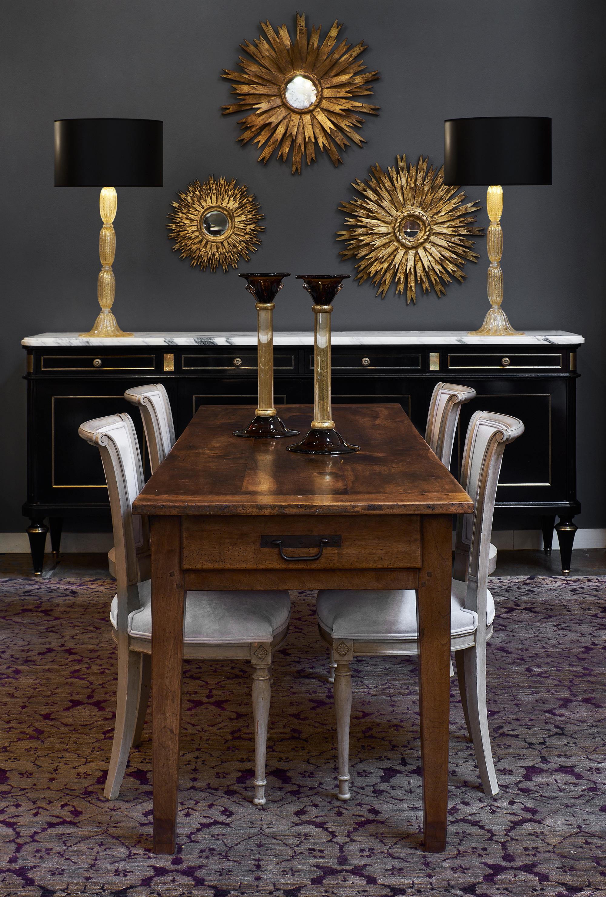 Spanish Renaissance style gold leaf sunburst mirror. We love the depth and texture of this gold leafed piece with the original central mirror intact.