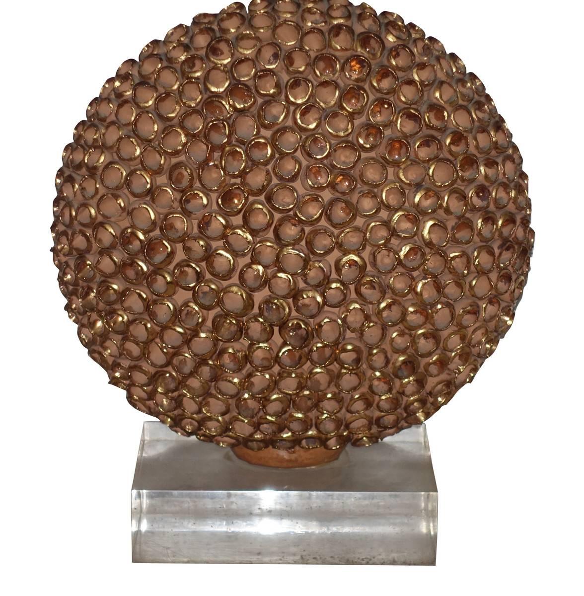 Contemporary French terracotta sphere with textured gold leaf decorative surface single lamp.
Measures: Lucite base measures 9.5
