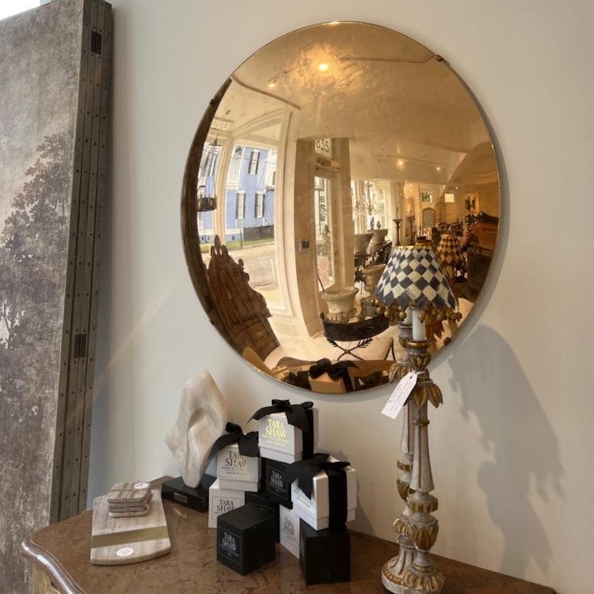 An incredible mirror that reflects the entire room! It makes quite a statement due to it's size and color. The mirror has been gold leafed by hand and that human touch and expert craftsmanship is what really sets this piece apart from any other