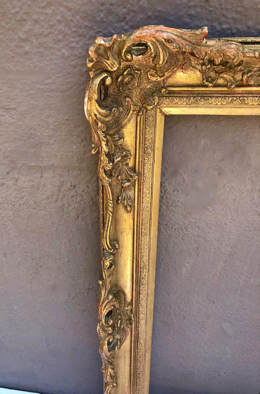 This is a fine French carved wood and gesso Louis XV-Style picture frame that dates to the early 20th century. The frame is in overall very good condition with normal patination. This frame would make a wonderful mirror. We have not inserted a