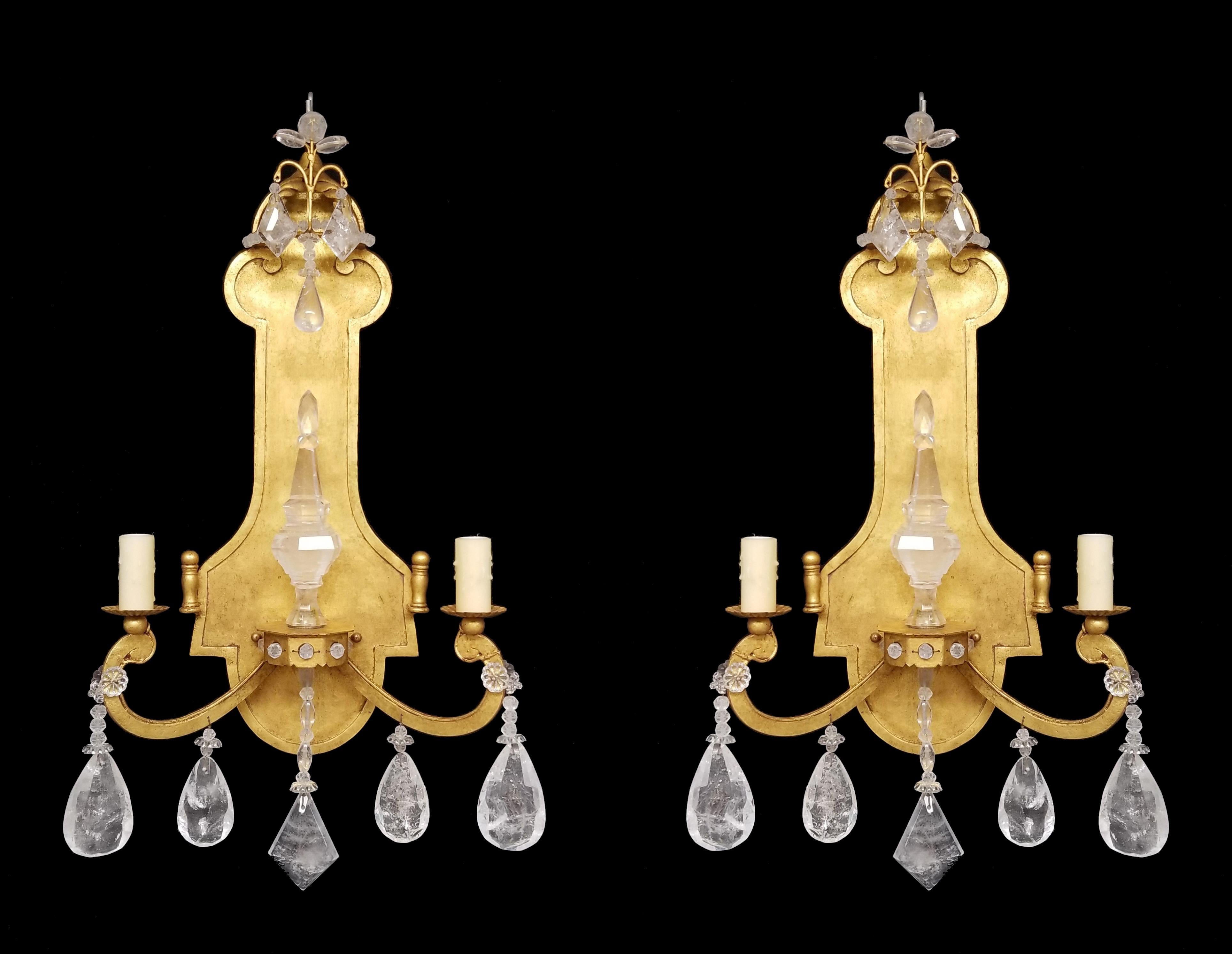 Charming pair of gold leafed hand forged wrought iron two light sconces with Rock crystal prisms and large rock crystal spike in the center. 
They are sensational.
They come in two sizes:
H. 26