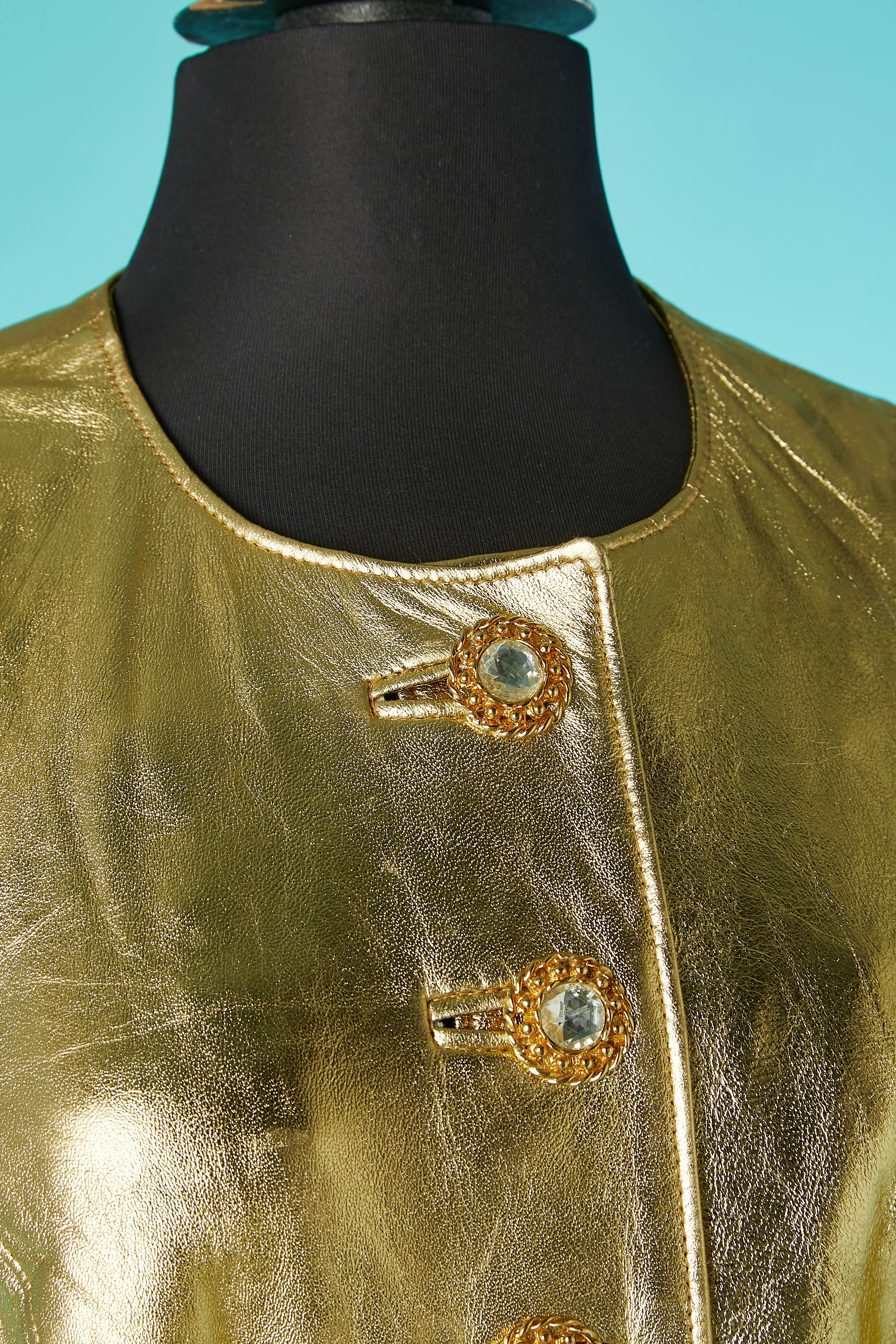 Gold leather evening vest with jewellery buttons. No fabric composition but probably rayon lining. 
SIZE S