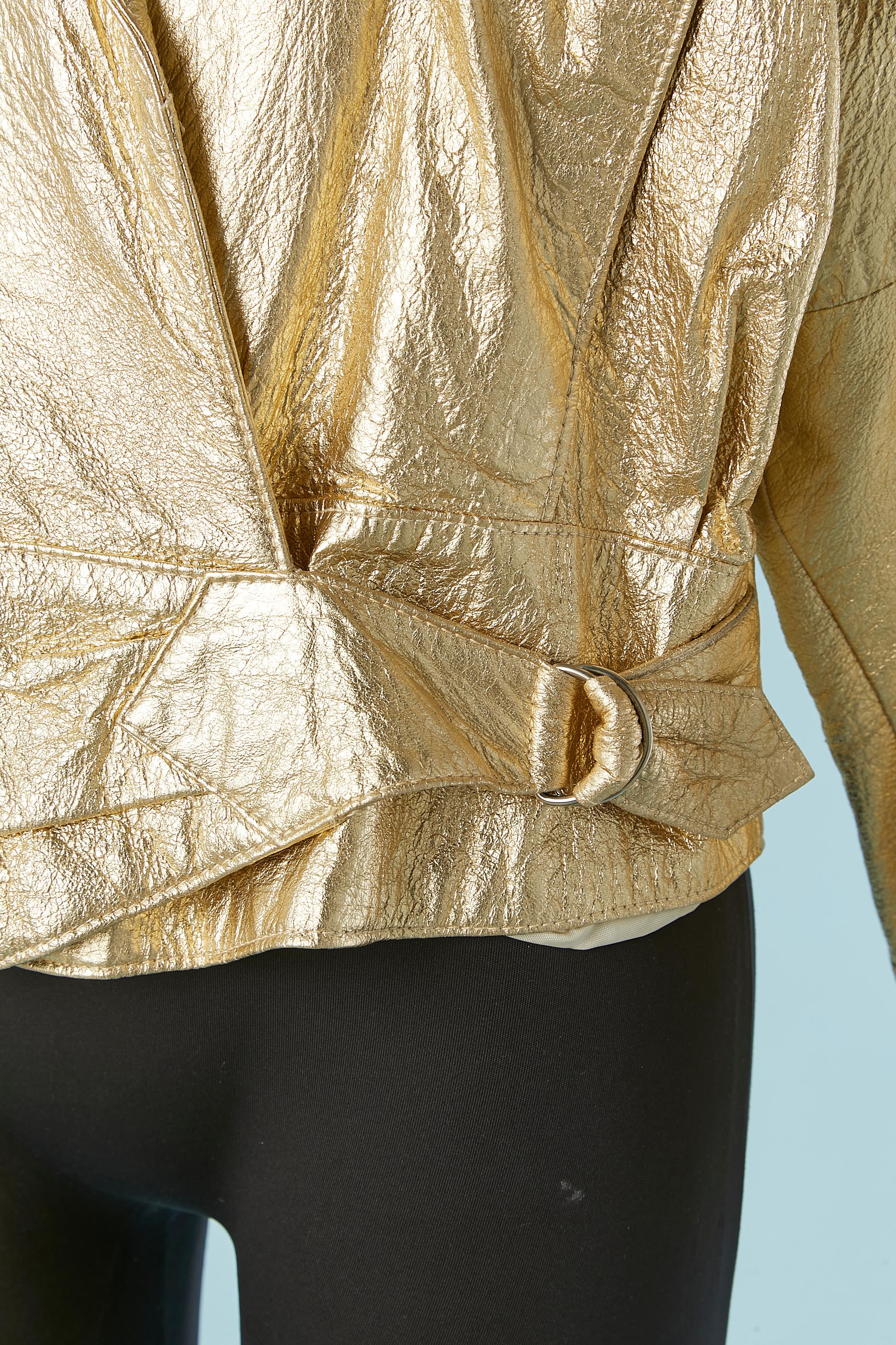 Gold wrinkled leather jacket with buckle on the waist with rayon or acetate lining. 
Pocket on both side.
SIZE M 
