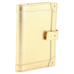 Gold leather Louis Vuitton Suhali Partenaire PM Agenda Cover with brass hardware