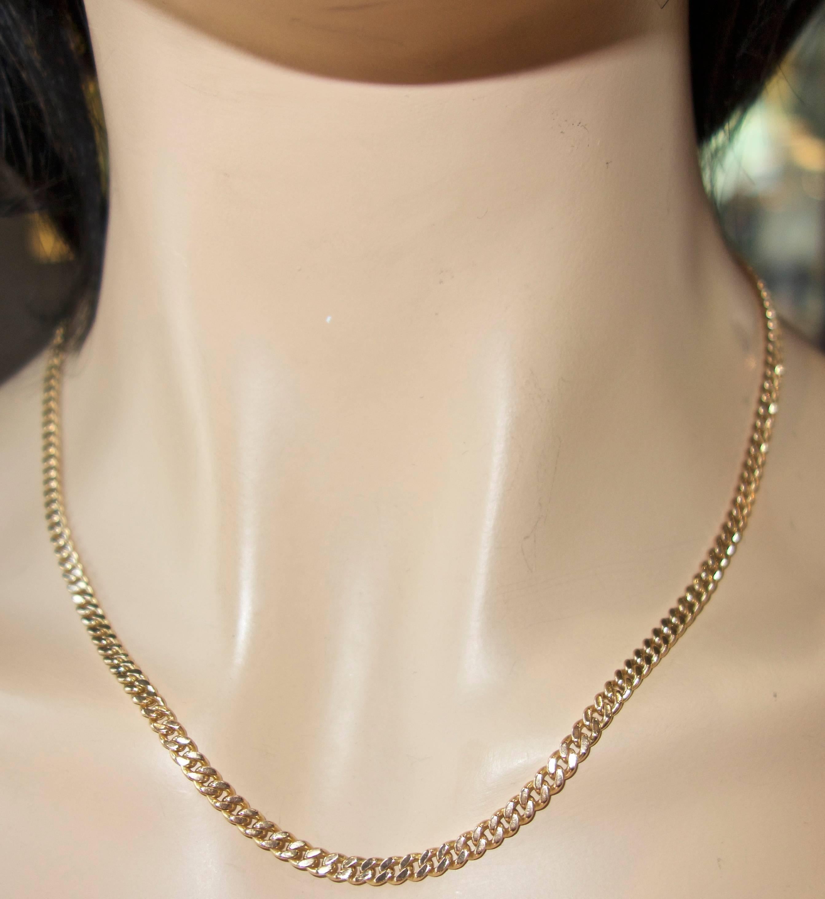 14K and 19 Inches long, this gold chain weighs 24.34 grams a sturdy clasp completes the design.