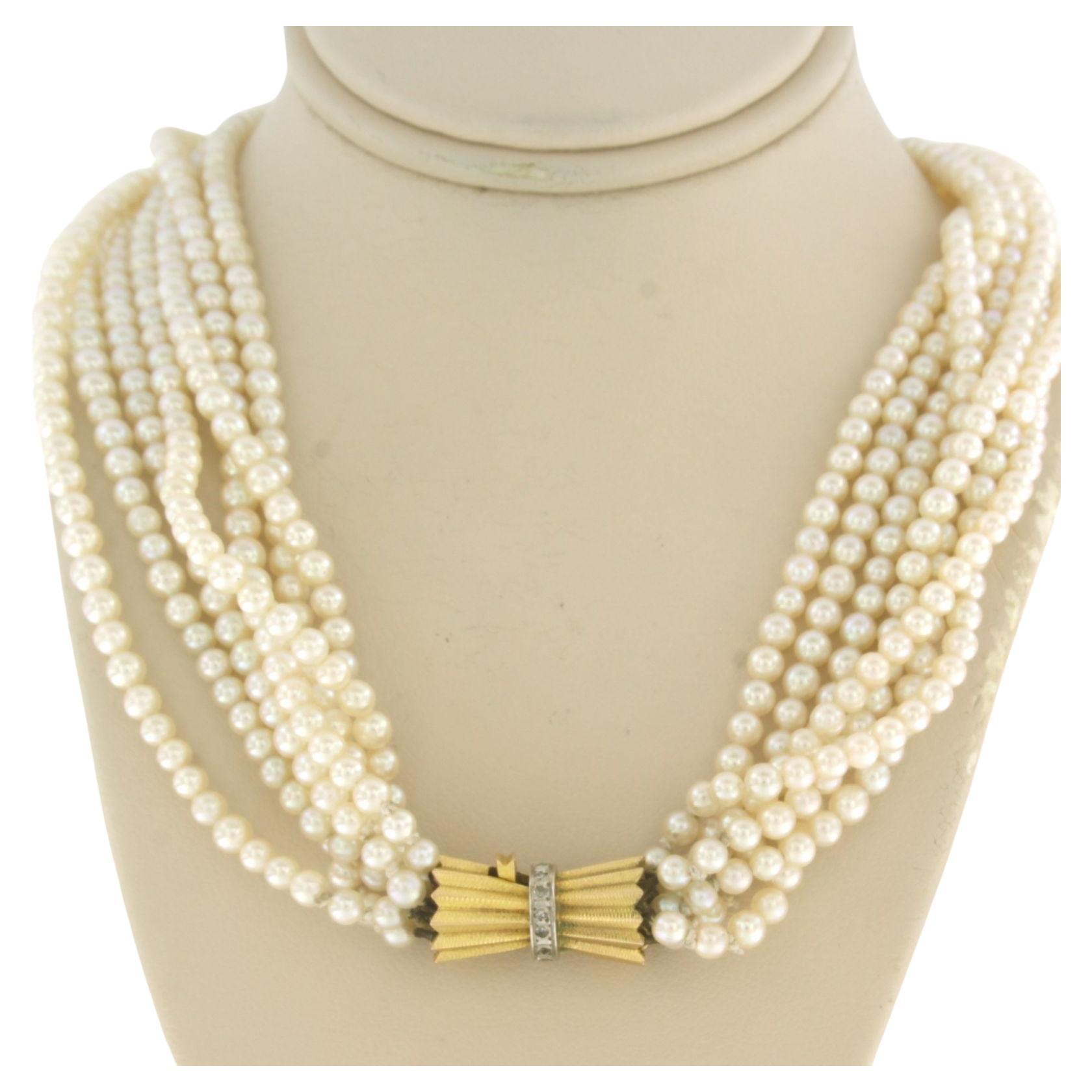 Gold lock with diamonds on an pearl bead chain 14k bicolour gold For