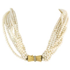 Gold lock with diamonds on an pearl bead chain 14k bicolour gold