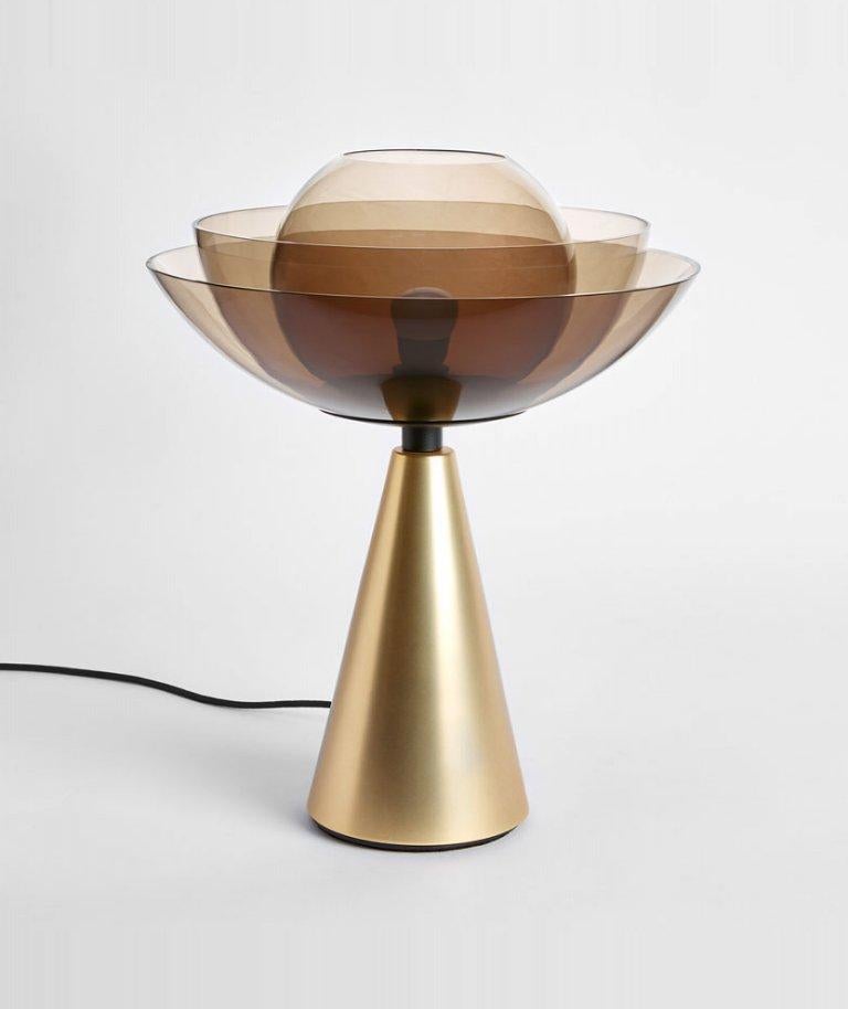 Gold lotus table lamp by Mason Editions
Dimensions: 36 × 48 cm
Materials: matte gold 24k base + transparent smoke grey blown glass
Finishings: 
matte gold 24k base + transparent smoke grey blown glass
polished champagne gold base + transparent opal