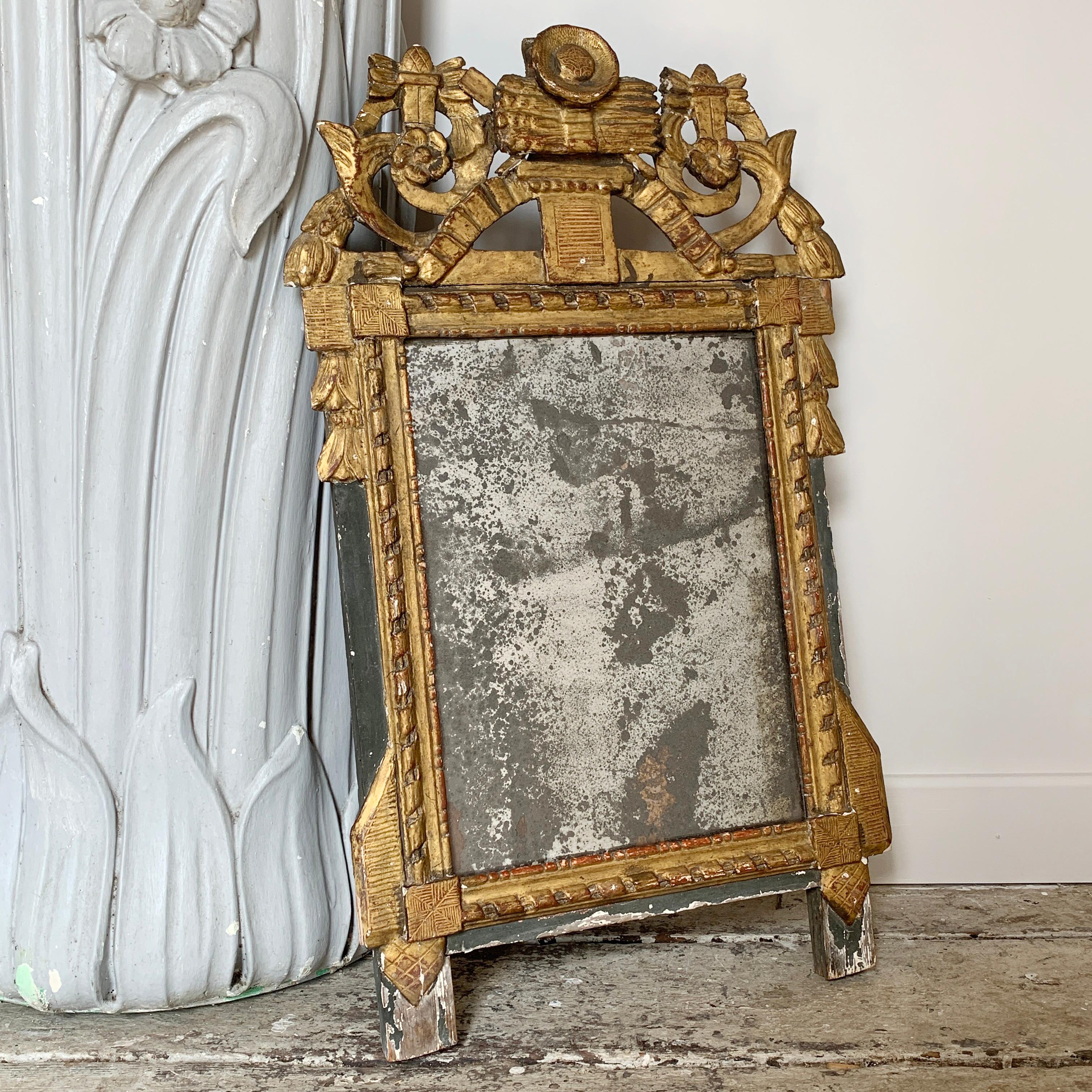Absolutely stunning 18th century Louis VXI French mirror, adorned with a wonderful carved wood, gesso and gilt decorative crest, it has minor loss of the gesso in parts and boasts the original 18h century mercury plate, which has foxed over time in