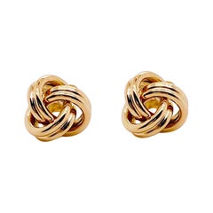 Clous d'oreilles nœud d'amour en or jaune 14 carats