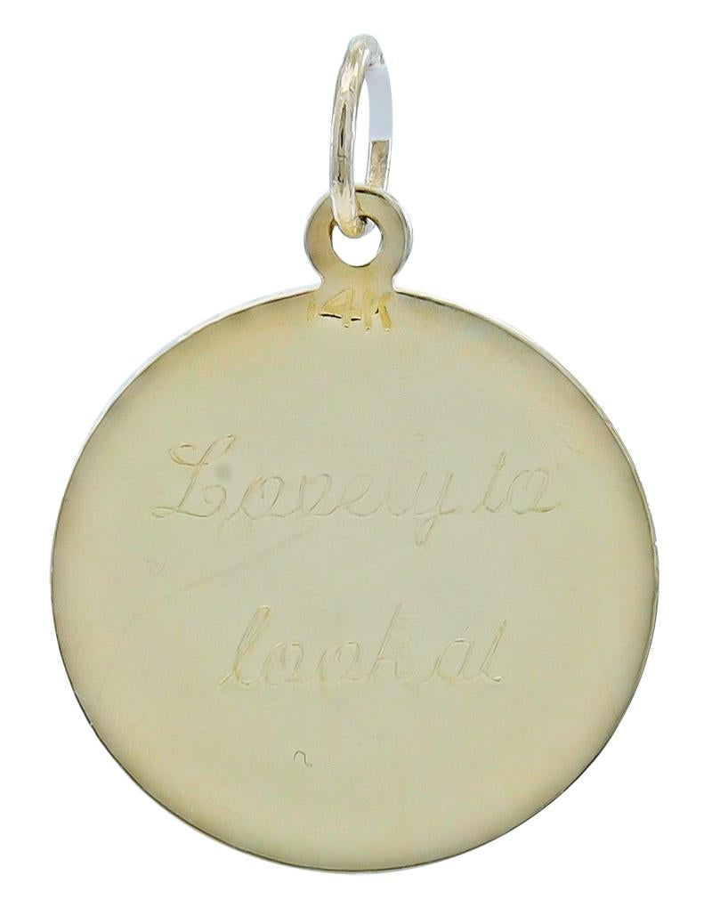 Round disc.  The front has a bright line cut border; it has a shiny gold reserve in the center, perfect for engraving a name or message.  The reverse side is engraved 