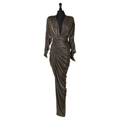 Abito da sera in jersey lurex oro avvolto e drappeggiato ALEXANDRE VAUTHIER New