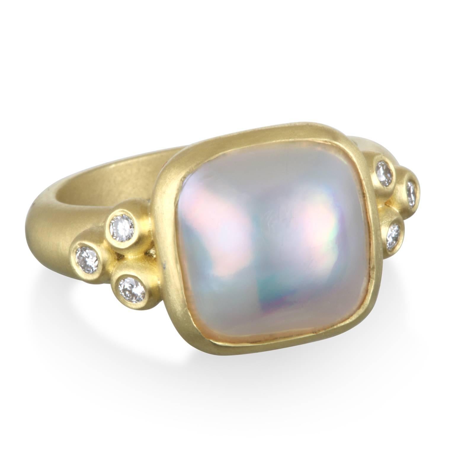 Handcrafted in 18k gold, this cushion shaped mabe pearl and diamond ring is the perfect blend of classic and contemporary design. The matte green gold bezel highlights the Mabe pearl's gem qualities of exceptional color and luster. 
This fashionable
