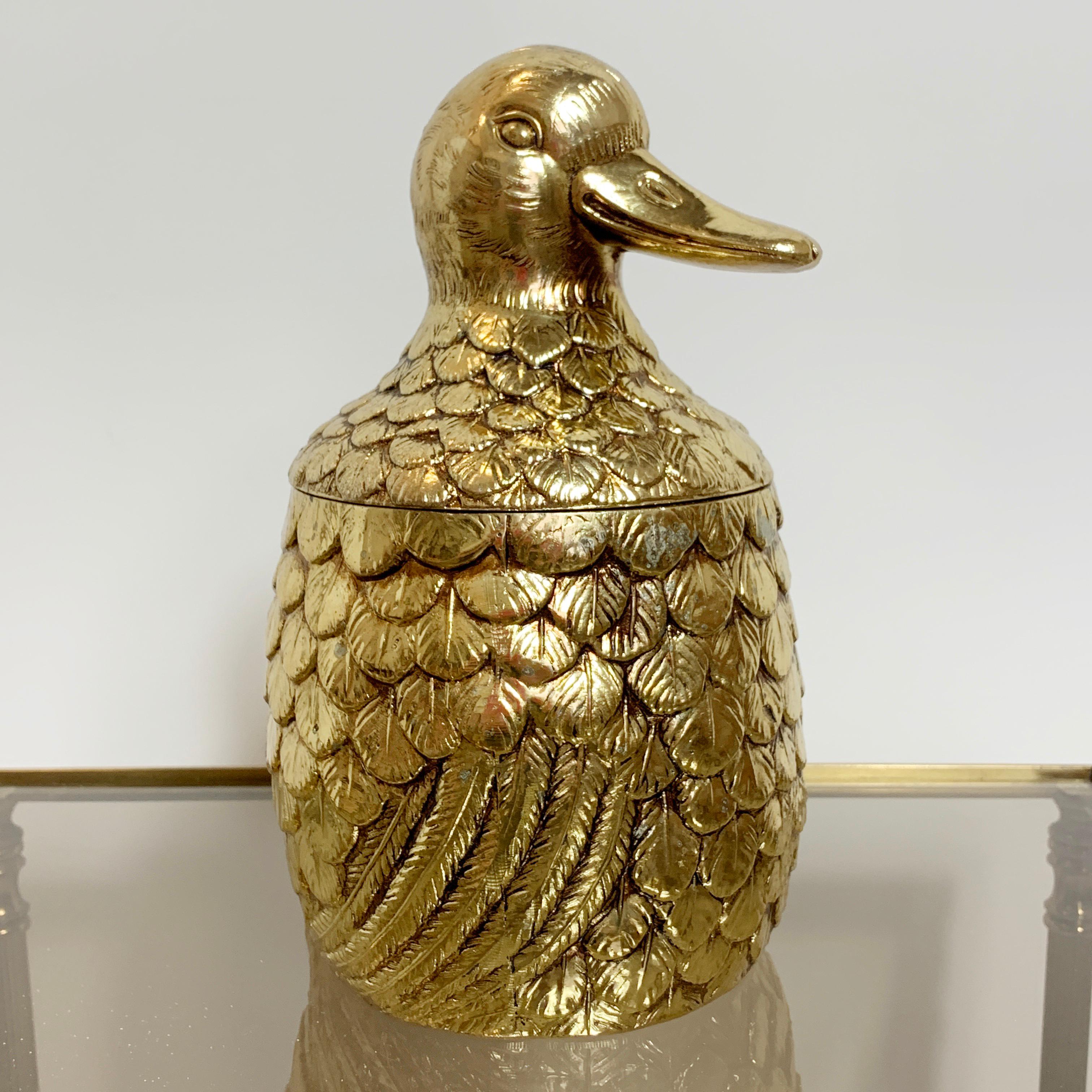 Fabulous rare gold color duck ice bucket by Mauro Manetti, Italy
circa 1960s
The duck has its original very bright solid gold finish all-over
There is a liner in the lid of the duck and in the body
Stamped M/M Italy On The Underside Of The
