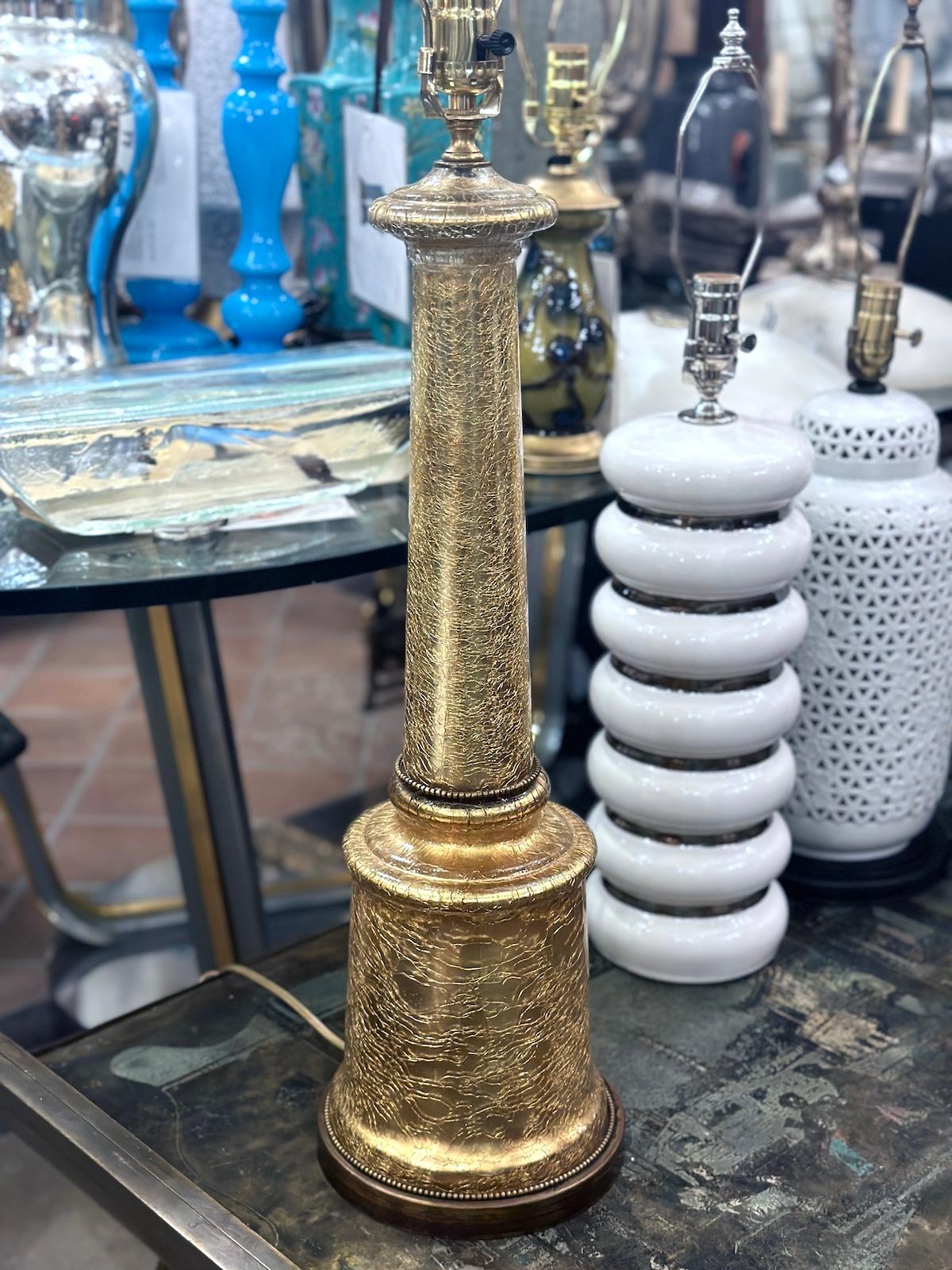 A circa 1970's French crackled mercury glass column shaped table lamp with metal base.

Measurements:
Height of body: 24