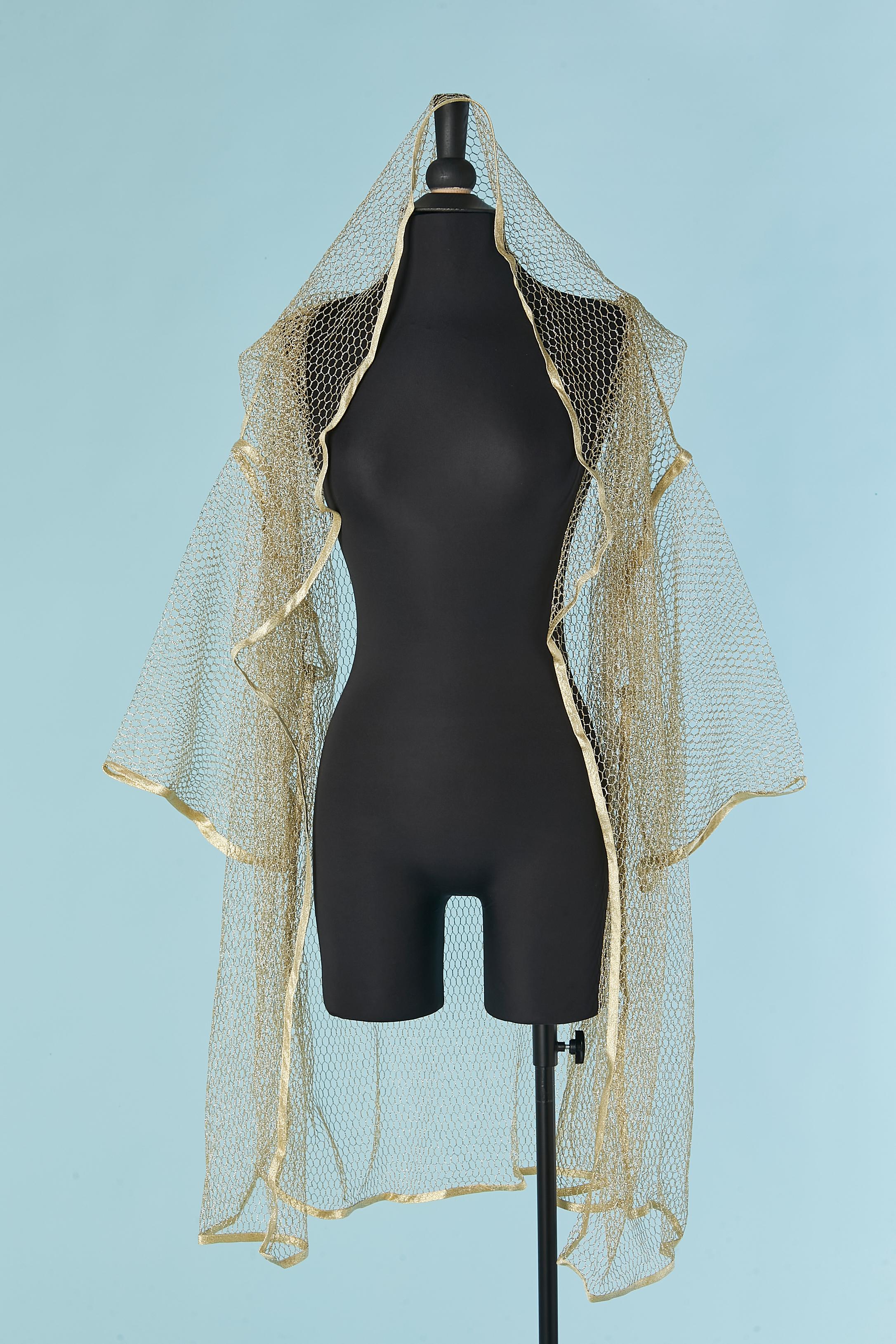 Gold mesh tulle oversize coat with hood. Gold piping. Fabric composition 70% metallic, 30% nylon. 
SIZE S on tag but fit oversize L/XL 