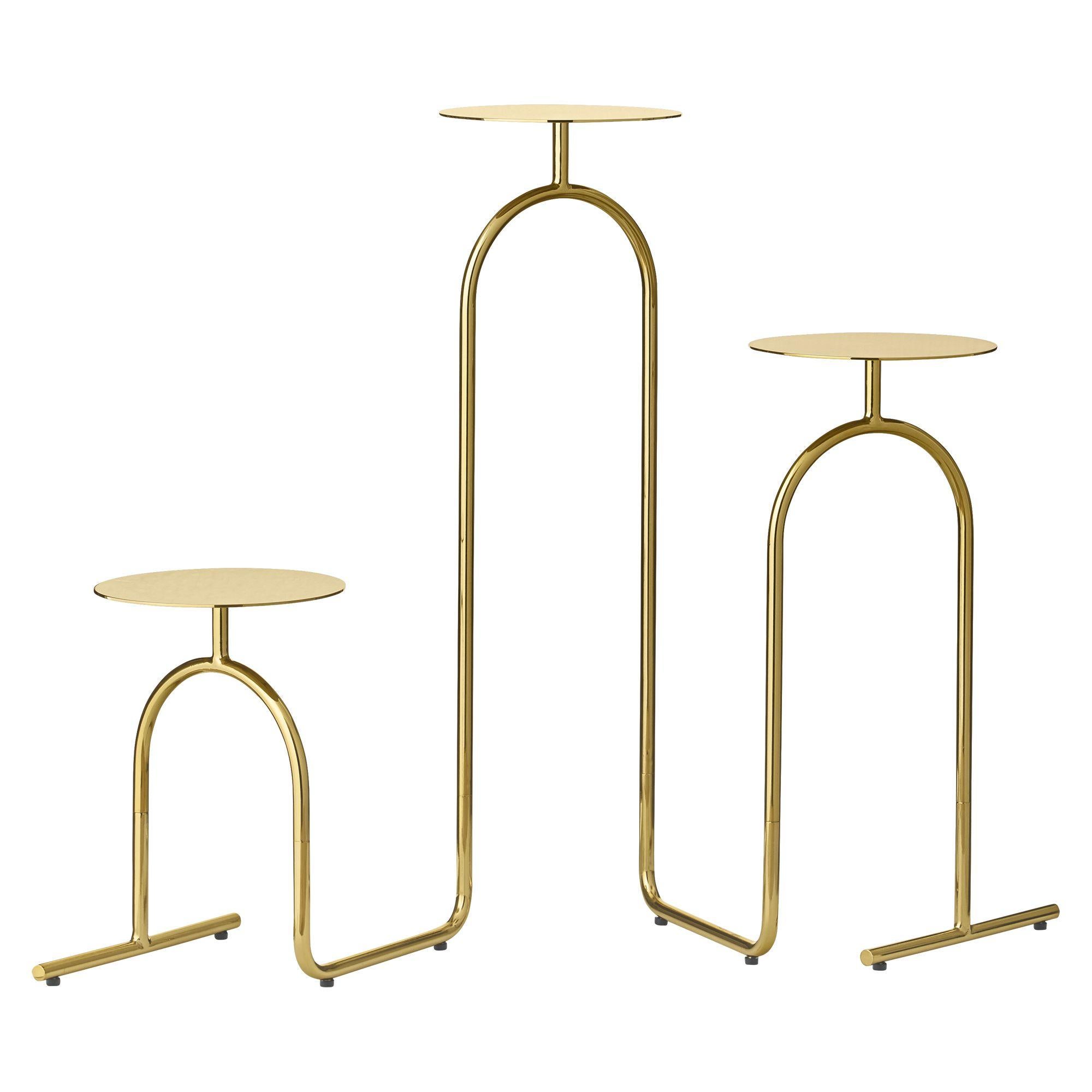 Gold minimalist pedestal table
Dimensions: D 53.4 x W 22 x H 75 cm 
Materials: Steel. 
Available in black. 

Sometimes the absolute smallest things are what matter the absolute most to us. It's the details in our lives, that sculpt the