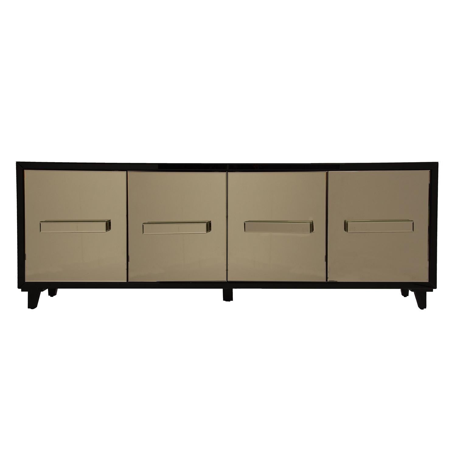 Amazing and sophisticated gold mirrored sideboard with four mirrored doors that open on shelves. Classy, trendy and glossy! (New item, never used).
 