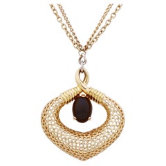 Jomaz, collier pendentif fantaisie en or avec cabochon en onyx, années 1970