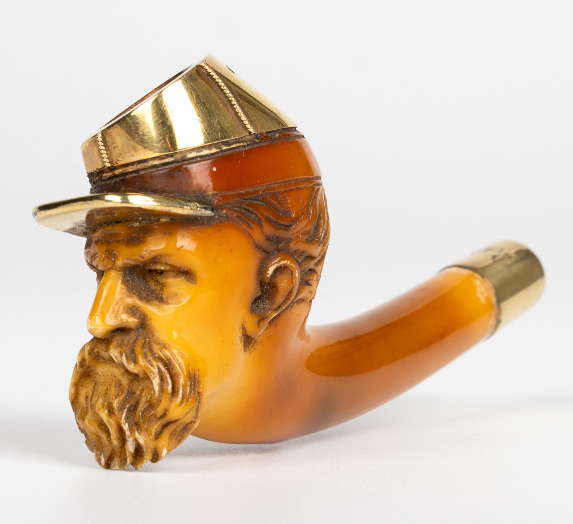 A very rare and exquisitely carved meerschaum pipe bowl portraying the head of an American Confederate soldier and mounted with gold dating from around 1860. The head has been finely carved with a beard and facial features with a wonderful polished