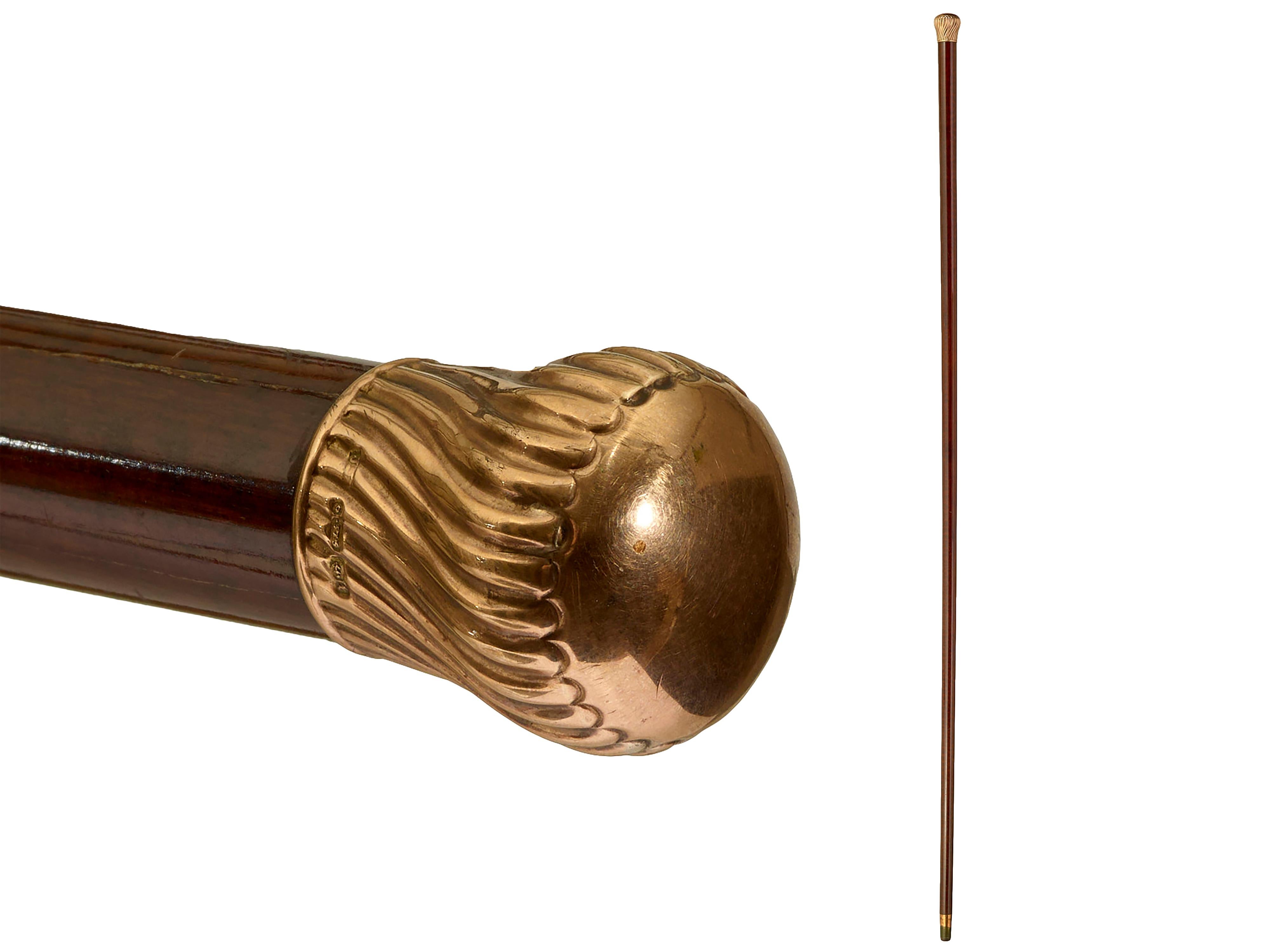 Gold mounted walking cane
9 ct marked gold topped cane in good condition on snakewood shaft. Original ferrule.L 92cm, round top 3cm dia. Circa 1900. English.