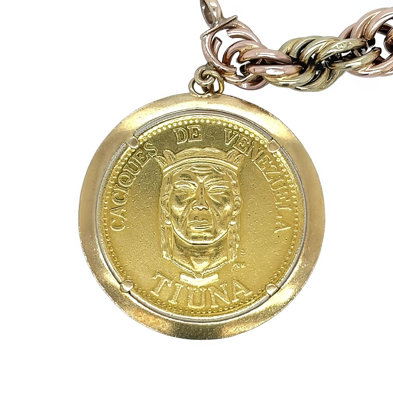 A 14 karat yellow and rose gold, 18 karat yellow gold and high karat gold bracelet.  Designed as length 14 karat yellow and rose gold graduated rope chain suspending four high karat gold coins in 18 karat gold frames, the coins consisting of: a 1956