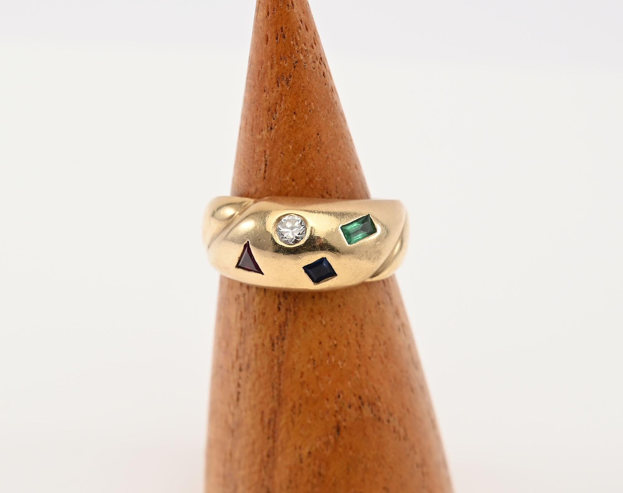 Delicate 14 karat gold ring with four inlaid stones.  There is a triangular ruby: a square sapphire; a rectangular emerald and a round diamond. The ring is size 6 1/4. It can easily be sized larger or smaller. The front of the ring is 5/8