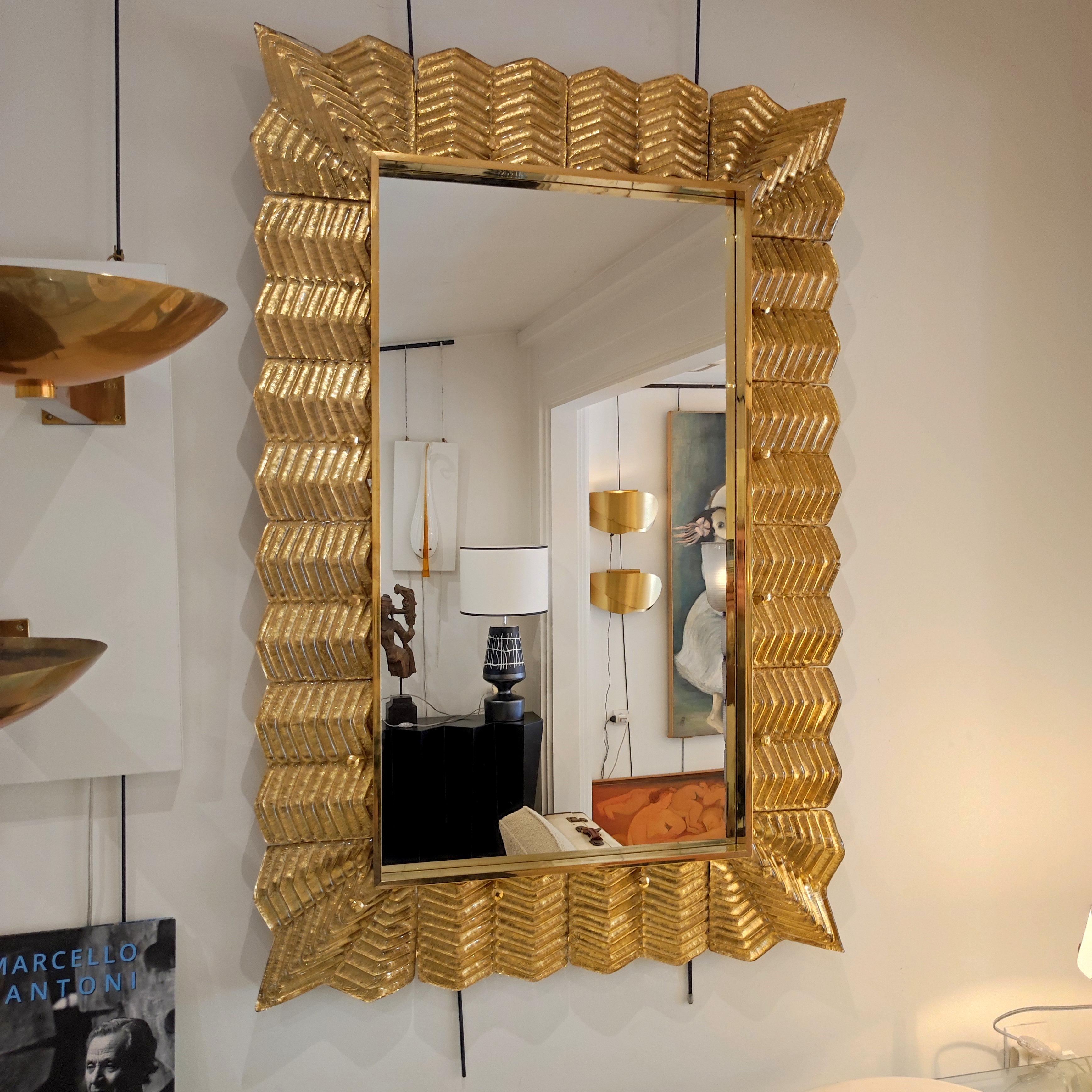 Gold Murano glass and brass mirror, 
(on wood panel)
Measures: 120 cm x 80 cm
Height or width position.
 