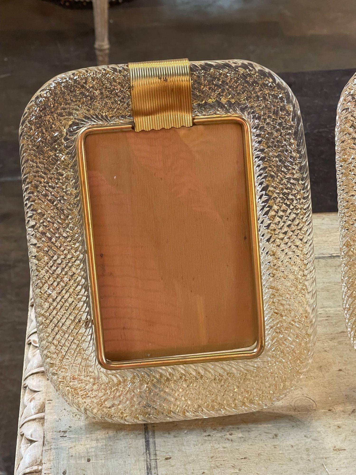 Decorative gold Murano glass picture frame. Featuring beautiful textured glistening glass. Also available in other colors as you can see in the pictures. Makes a fabulous accessory or special gift!.