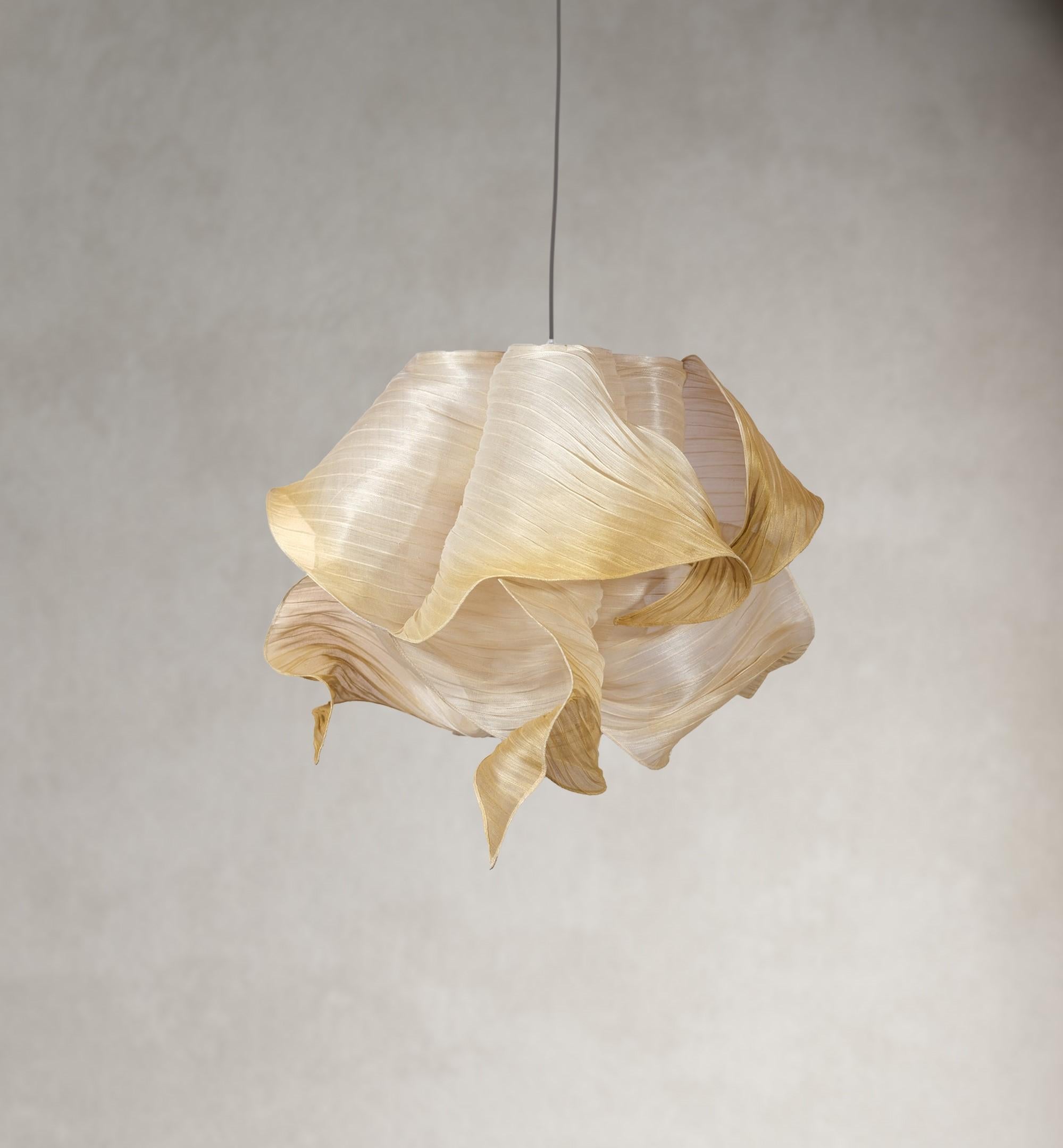 Gold Nebula hand painted pendant lamp by Mirei Monticelli
Dimensions: D 60 x W 60 x H 60 cm
Materials: Banaca fabric
Also available in hand painted fabric.

Providing soft light in an organic and unique design, the Nebula Lamp draws its