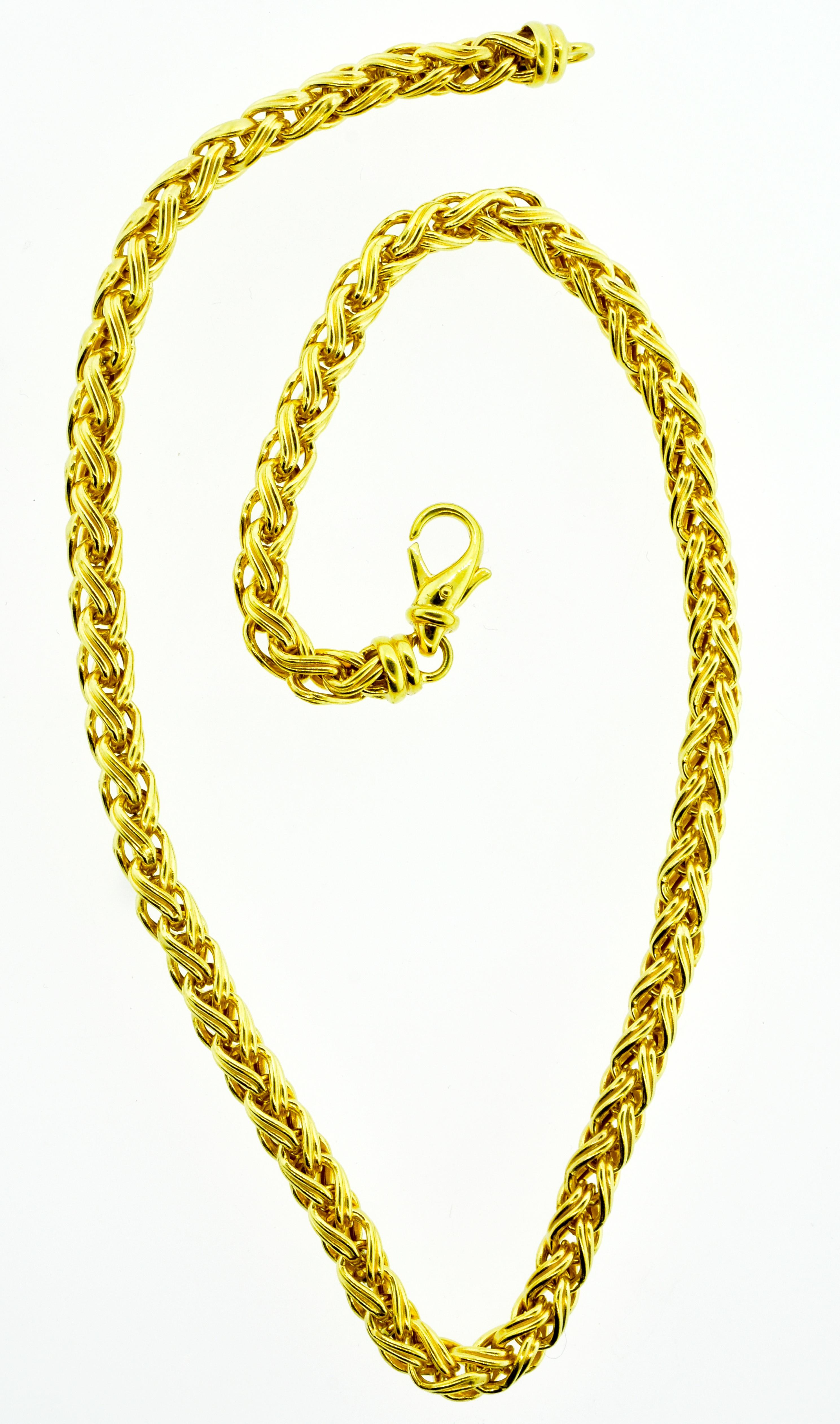Gold Chain necklace with an unusual fine woven design.  17 inches long with a secure clasp, this necklace can worn alone or suspending a lovely companion pendant.  Contemporary and in fine condition and weighing 27.74 grams, this necklace makes a