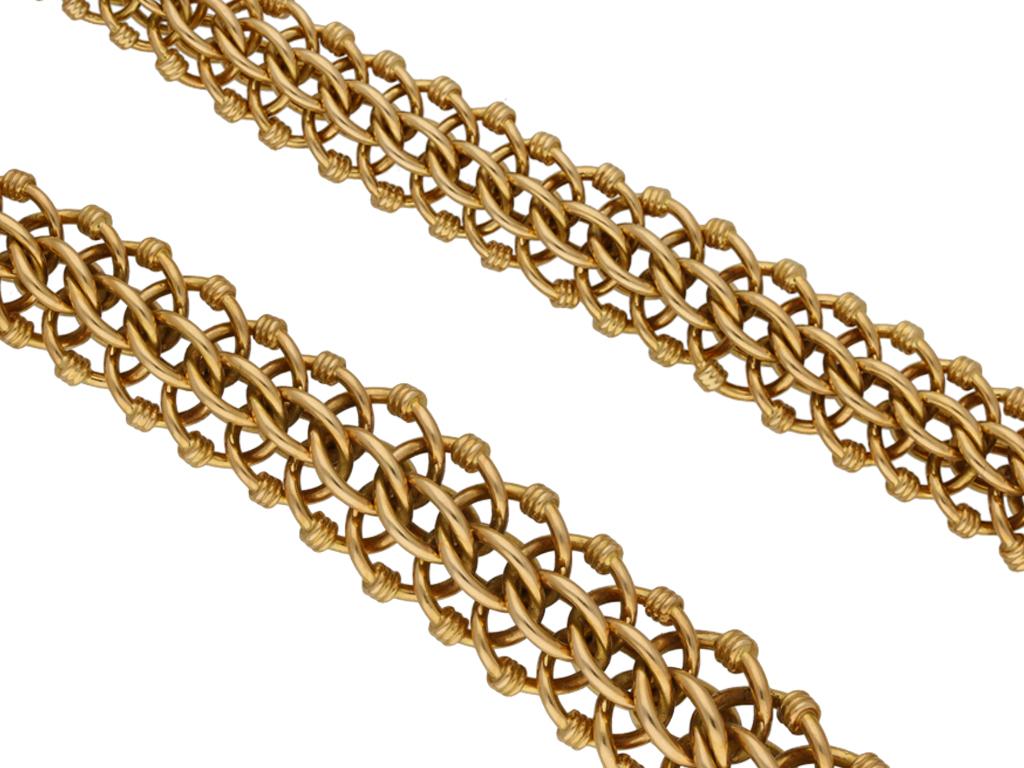 Gold necklace. A yellow gold chain composed of extremely intricate woven wirework links with fine twist detail, to a smooth flowing tapered link chain, approximately 17