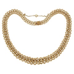 Gold necklace, French, circa 1940.