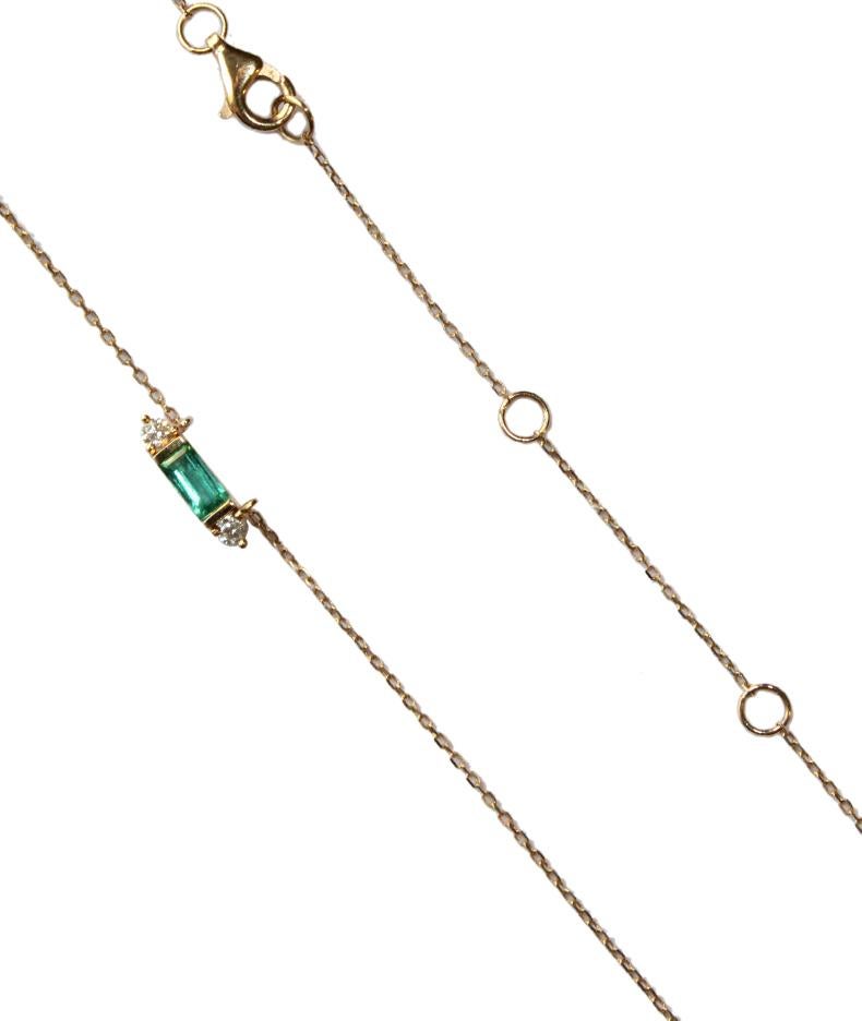 
Immerse yourself in the verdant embrace of nature with this captivating gold necklace, a symphony of emerald brilliance and sparkling diamonds. Crafted from luxurious 18K yellow gold, this piece weighs a delicate 1.41 grams, whispering tales of the