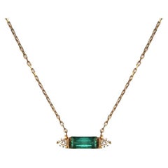  Gold Necklace with Baugette emerald and 2 Round Diamonds