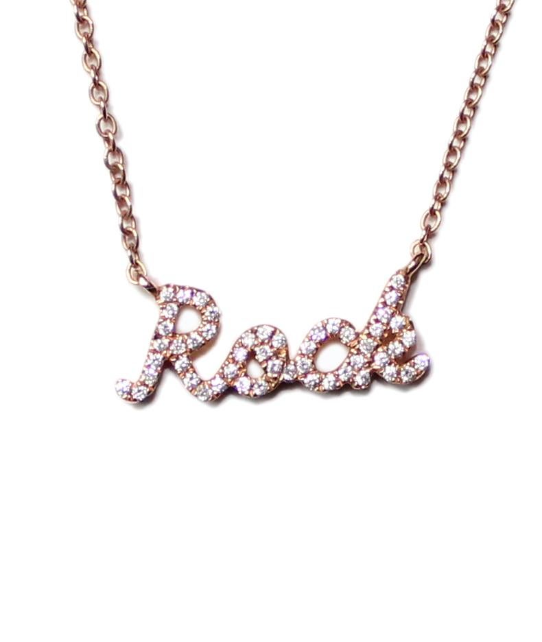 Immerse yourself in the captivating world of rock 'n' roll with this exquisite diamond necklace, a dazzling emblem of the genre's unwavering spirit and empowering influence. Crafted from luxurious 18K gold, this necklace shimmers with the brilliance
