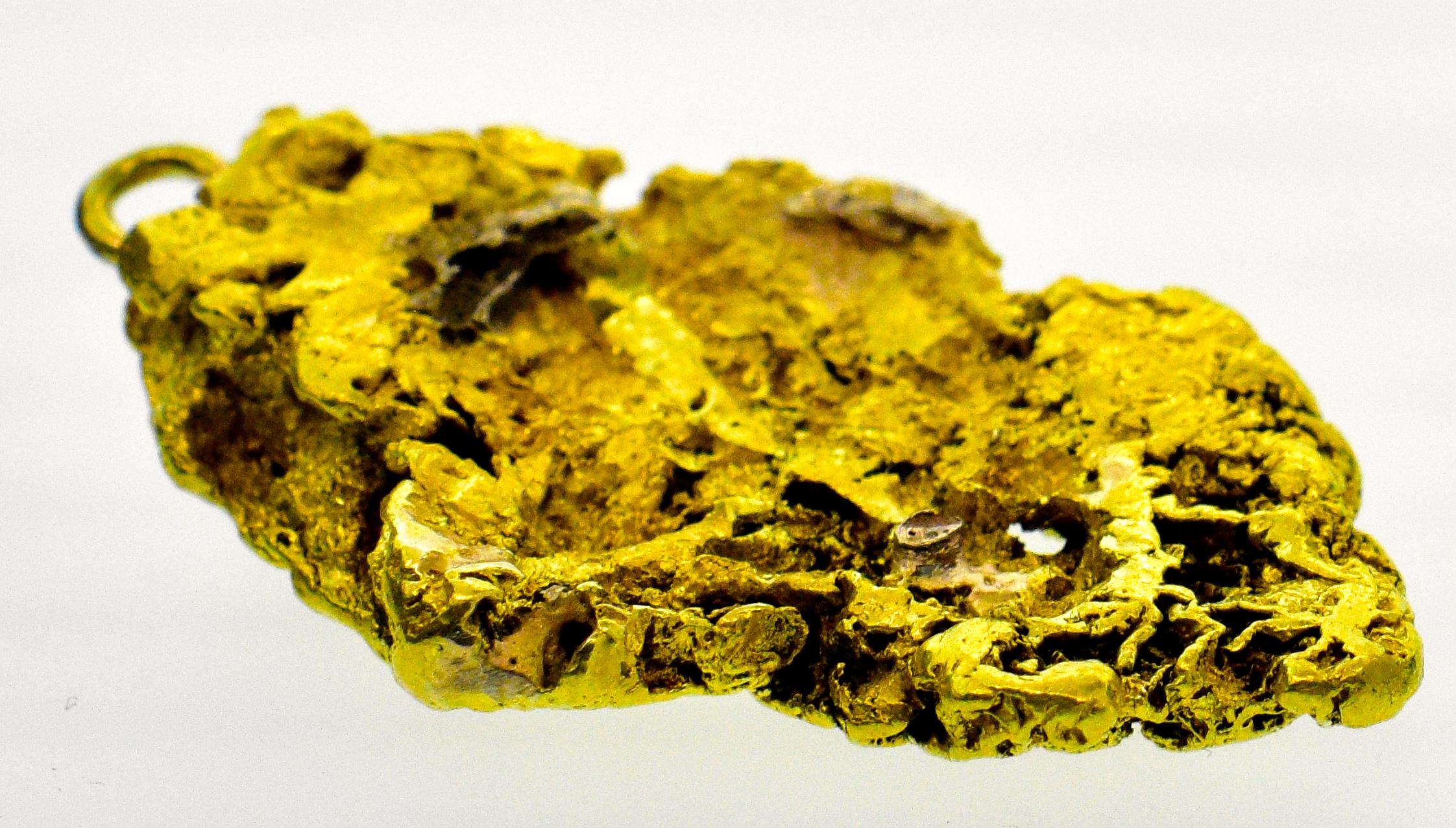 Gold nugget natural and quit large, tests above 22 ct., probably 19th century as gold nuggets are hard to find this large today. It measures slightly less than 2 inches. The piece weighs 31.53 grams.